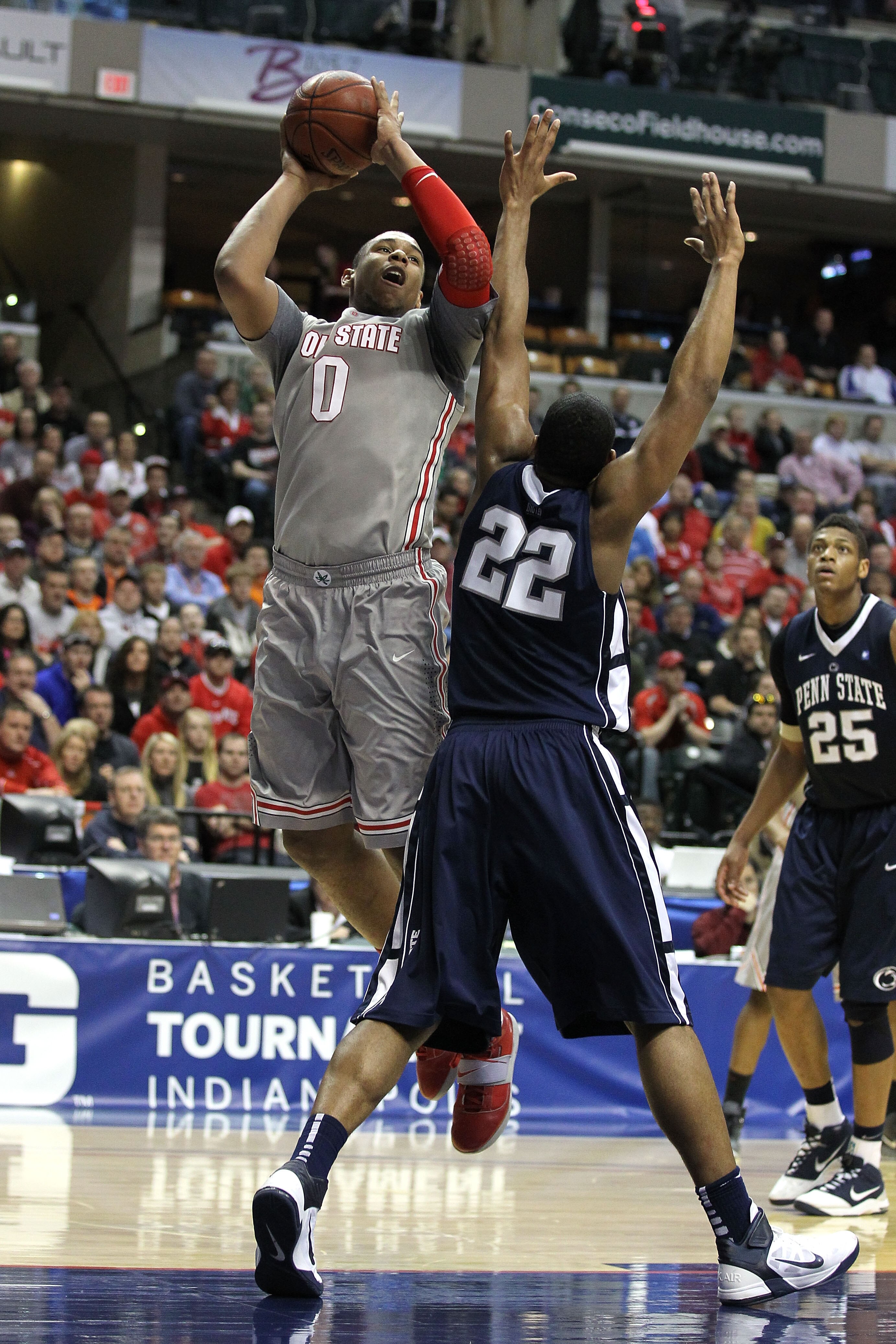 INDIANAPOLIS, IN - MARCH 13:  Jared Sullinger #0 of the Ohio State Buckeyes attempts a shot against Andrew Jones #22 of the Penn State Nittany Lions during the championship game of the 2011 Big Ten Men's Basketball Tournament at Conseco Fieldhouse on Marc