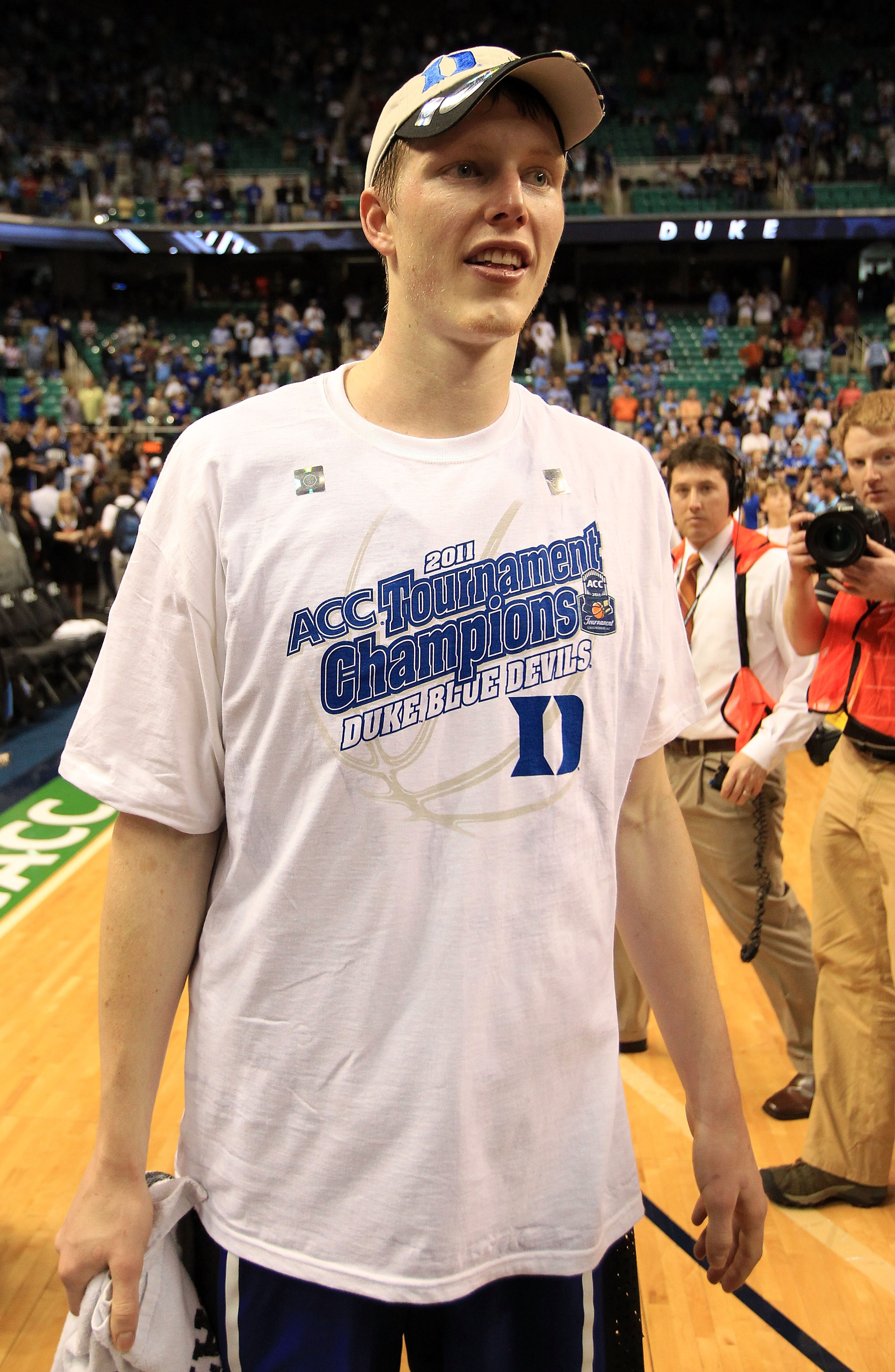 GREENSBORO, NC - MARCH 13:  Kyle Singler #12 of the Duke Blue Devils smiles after defeating the North Carolina Tar Heels 75-58 in the championship game of the 2011 ACC men's basketball tournament at the Greensboro Coliseum on March 13, 2011 in Greensboro,