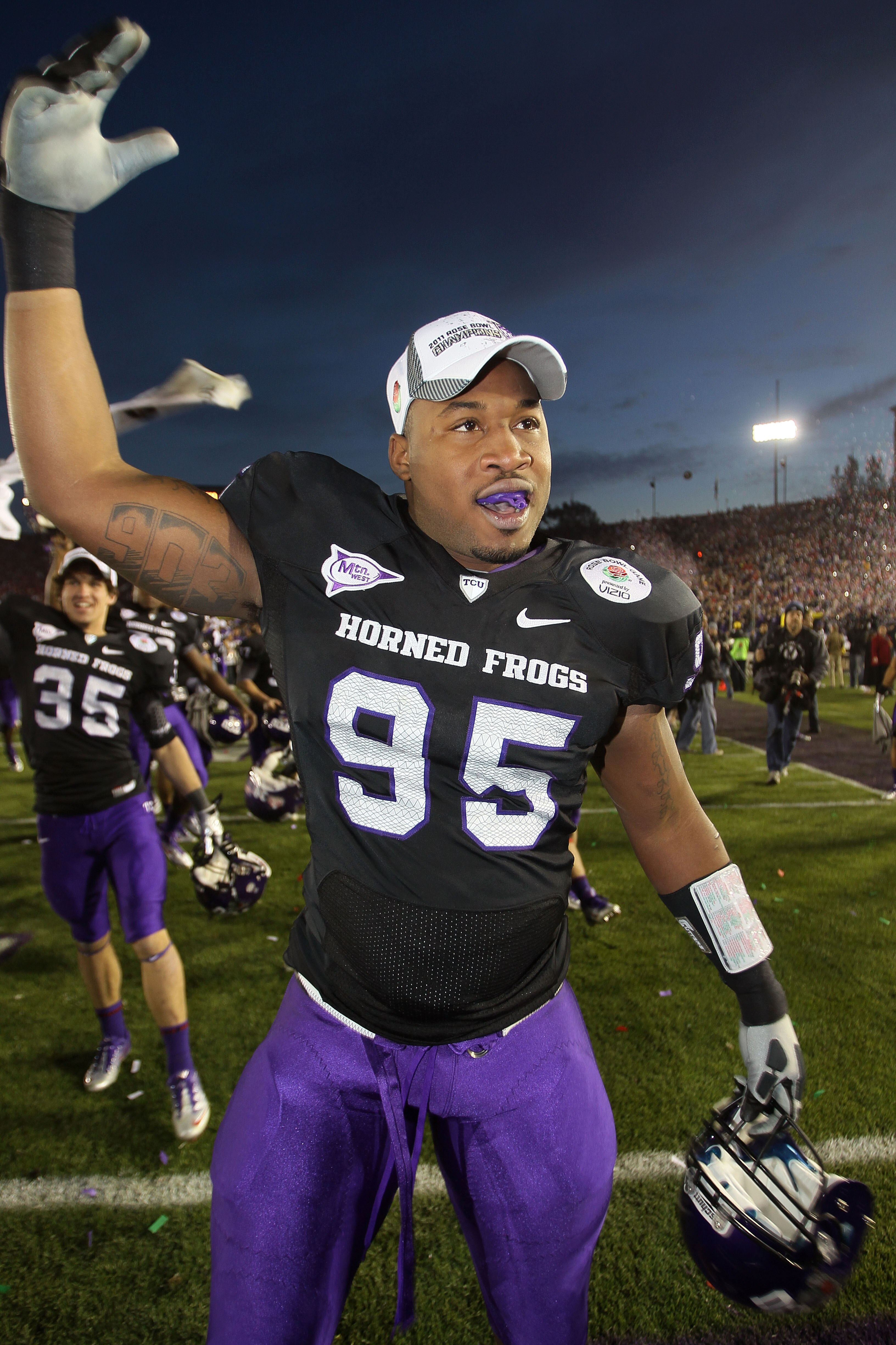 PASADENA, CA - JANUARY 01:  Clarence Leatch #95 of the TCU Horned Frogs celebrates after defeating the Wisconsin Badgers 21-19 in the 97th Rose Bowl game on January 1, 2011 in Pasadena, California.  (Photo by Stephen Dunn/Getty Images)