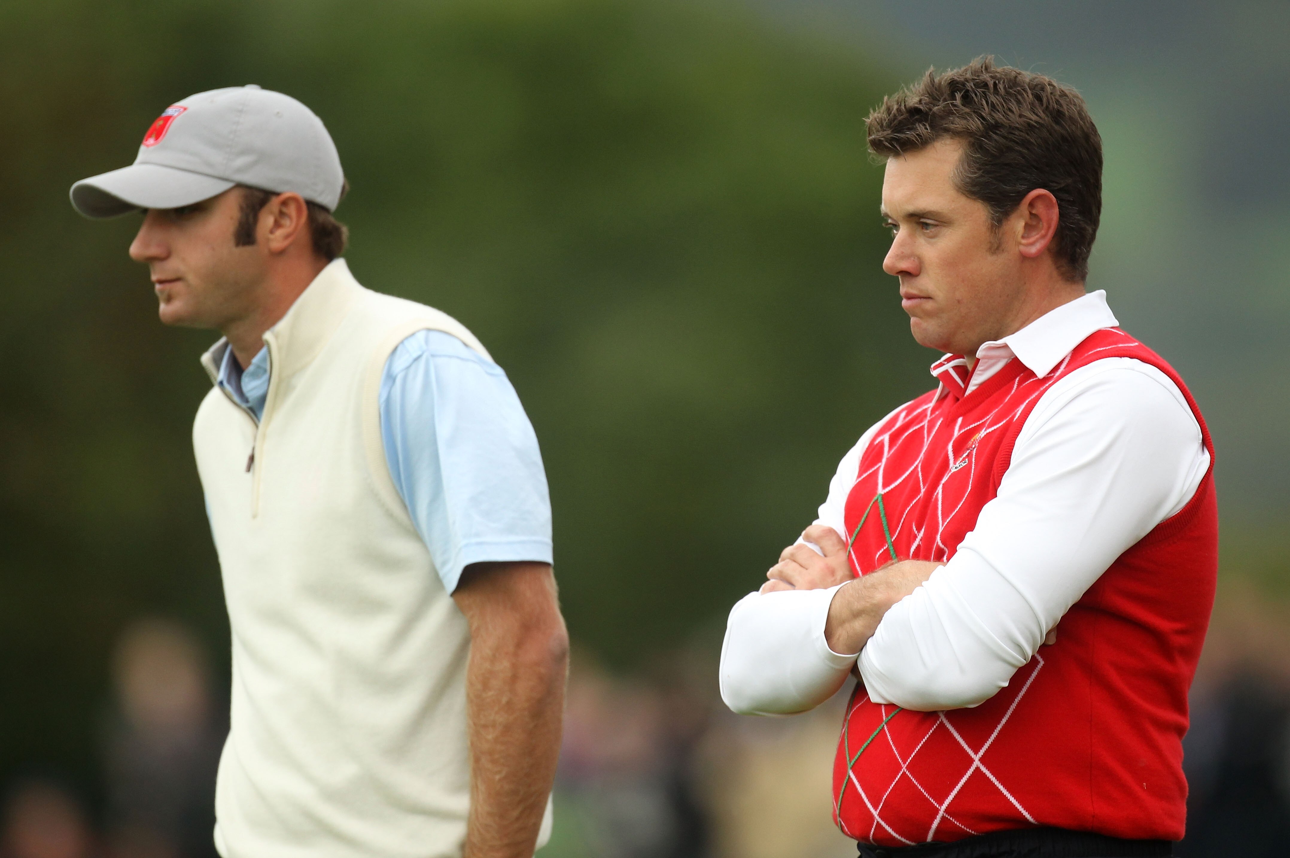 NEWPORT, WALES - OCTOBER 01:  Dustin Johnson (L) of the USA and Lee Westwood of Europe look on during the Morning Fourball Matches during the 2010 Ryder Cup at the Celtic Manor Resort on October 1, 2010 in Newport, Wales. (Photo by Ross Kinnaird/Getty Ima