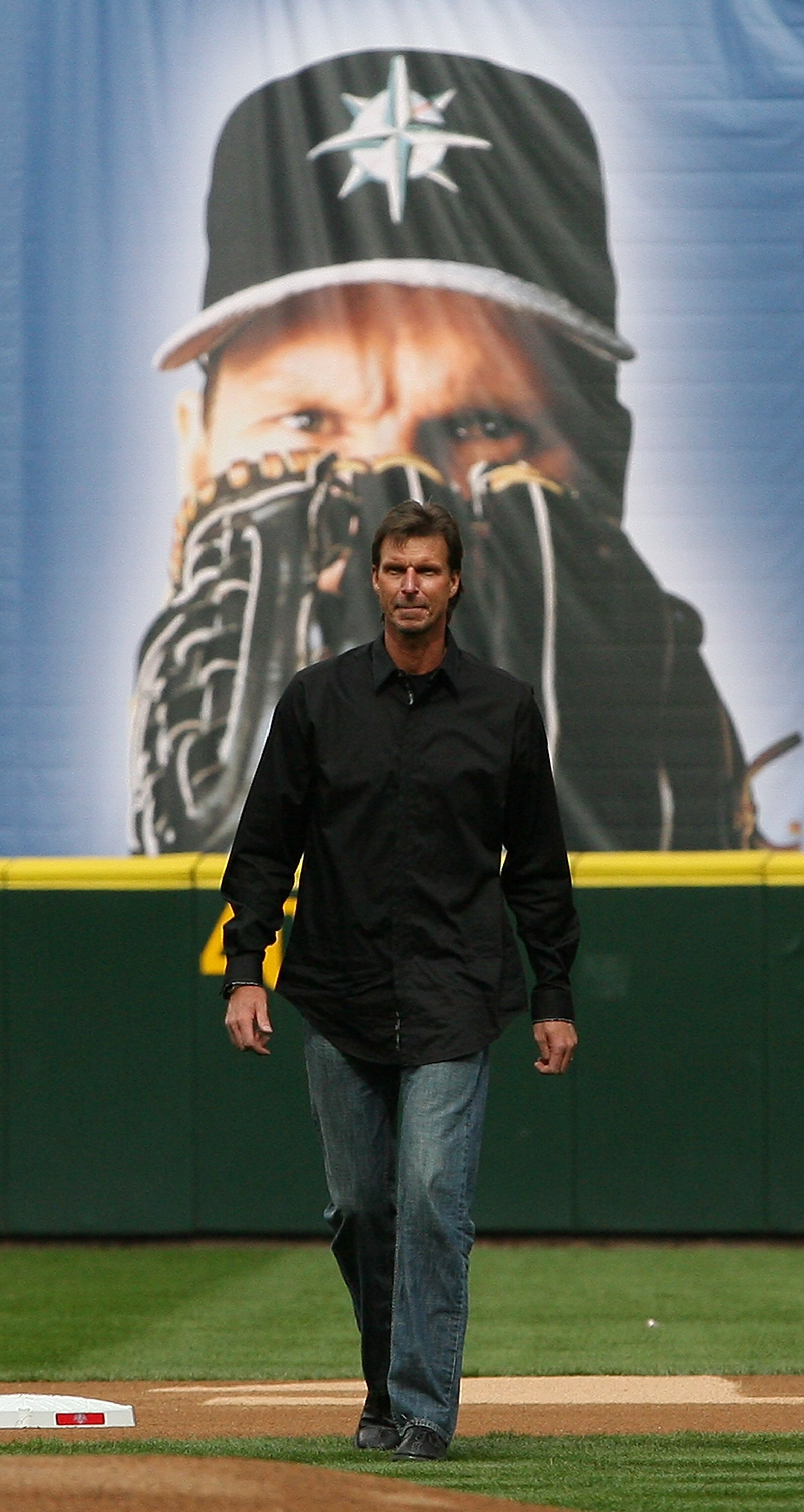 SEATTLE - APRIL 12:  Former Mariners star Randy Johnson walks on to the field to throw out the ceremonial first pitch prior to the Mariners' home opener against the Oakland Athletics at Safeco Field on April 12, 2010 in Seattle, Washington. The Athletics