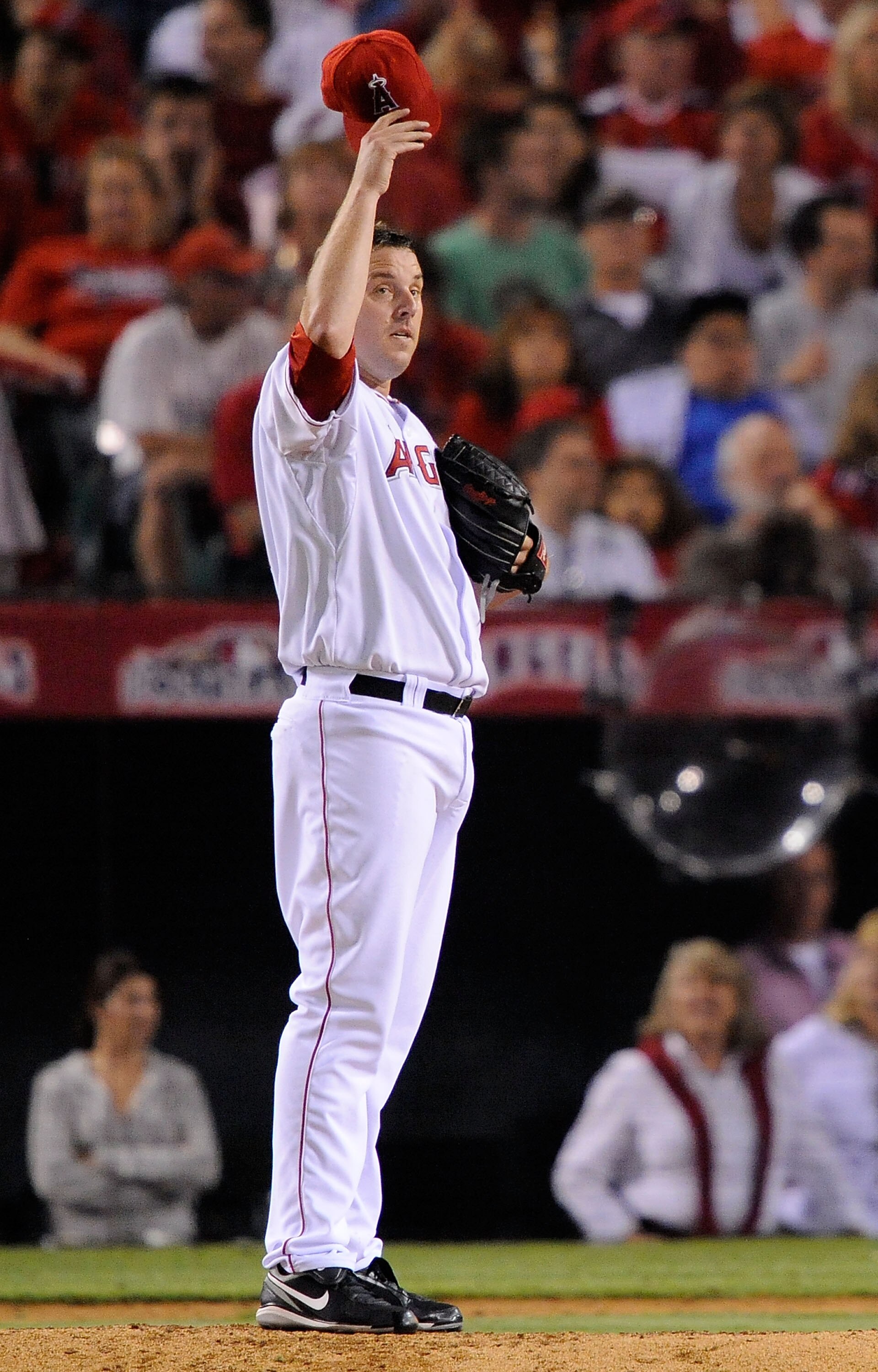 ANAHEIM, CA - OCTOBER 22:  John Lackey #41 of the Los Angeles Angels of Anaheim adjusts his cap during the seventh inning in Game Five of the ALCS against the New York Yankees during the 2009 MLB Playoffs at Angel Stadium on October 22, 2009 in Anaheim, C
