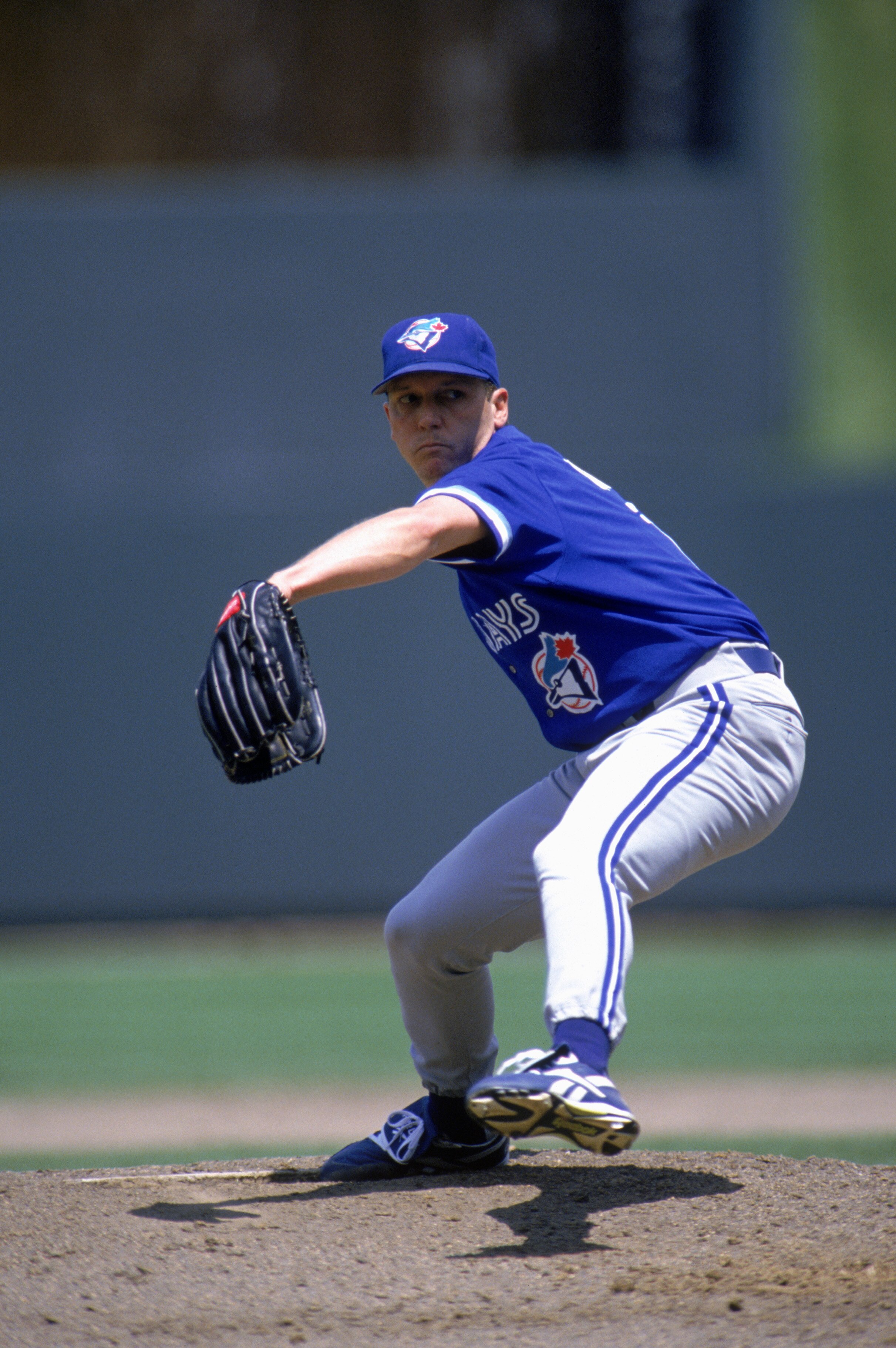 KANSAS CITY - JUNE 11:  David Cone #11 of the Toronto Blue Jays winds up for a pitch during a game against the Kansas City Royals during a game at Kauffman Stadium on June 11, 1995 in Kansas City, Missouri.  The Roylas won 2-1.  (Photo by Stephen Dunn/Get