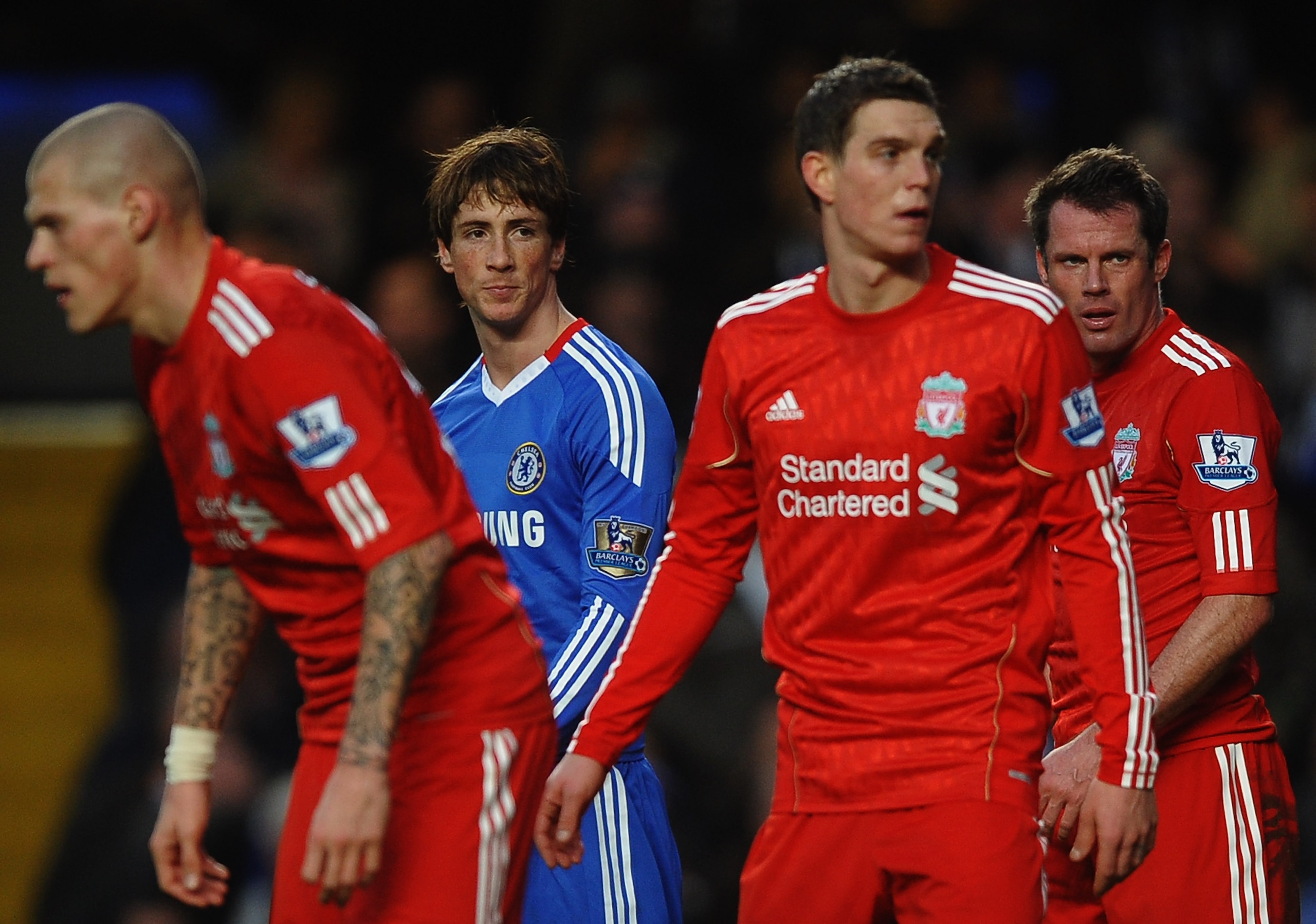 LONDON, ENGLAND - FEBRUARY 06: Fernando Torres of Chelsea looks across a Liverpool defenders Martin Skrtel (L), Daniel Agger (2R) and Jamie Carragher )R) during the Barclays Premier League match between Chelsea and Liverpool at Stamford Bridge on Februar LONDON, ENGLAND - FEBRUARY 06: Fernando Torres of Chelsea looks across a Liverpool defenders Martin Skrtel (L), Daniel Agger (2R) and Jamie Carragher )R) during the Barclays Premier League match between Chelsea and Liverpool at Stamford Bridge on Februar