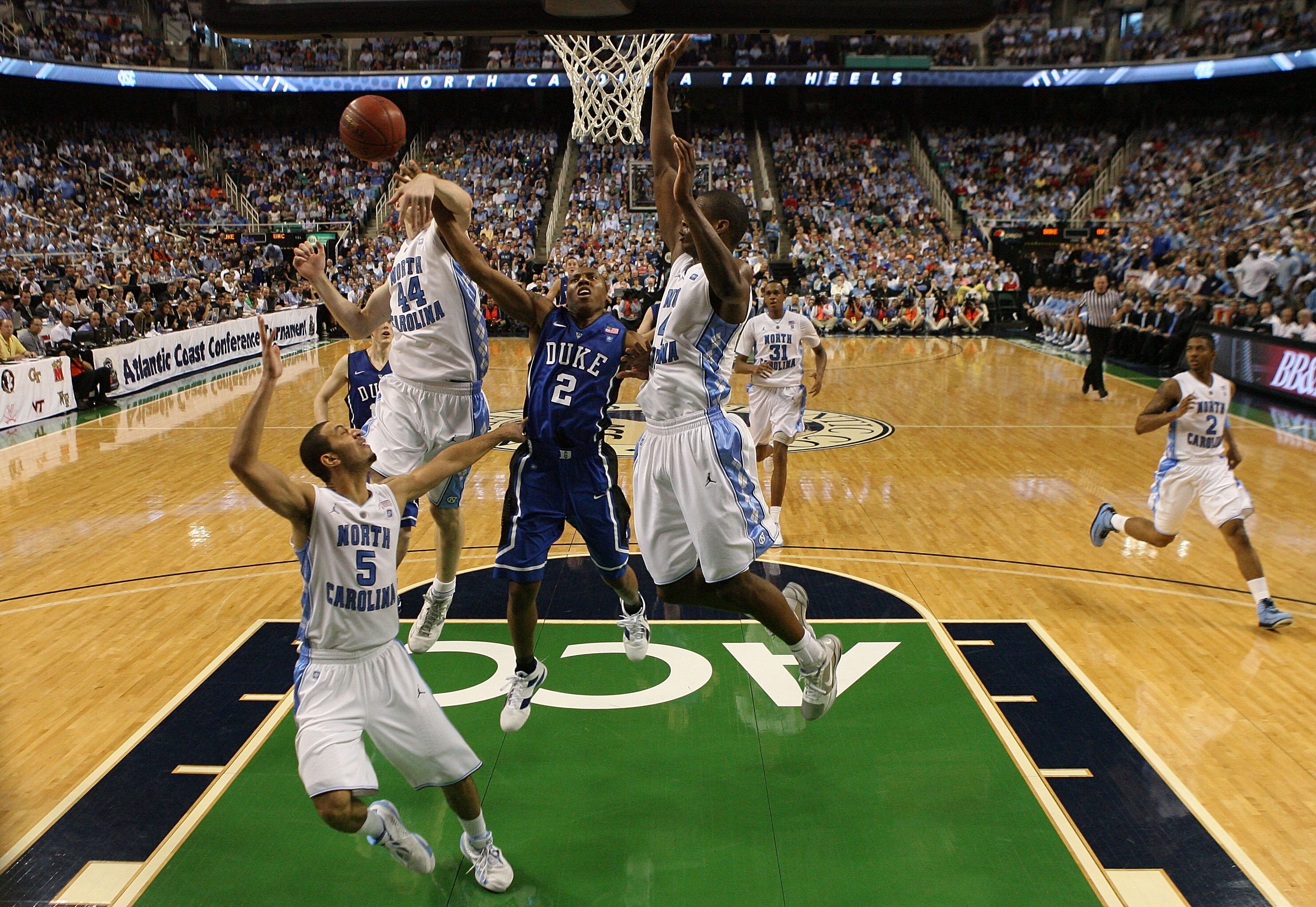 GREENSBORO, NC - MARCH 13:  Nolan Smith #2 of the Duke Blue Devils battles against Tyler Zeller #44, Kendall Marshall #5 and Harrison Barnes #40 of the North Carolina Tar Heels during the second half in the championship game of the 2011 ACC men's basketba