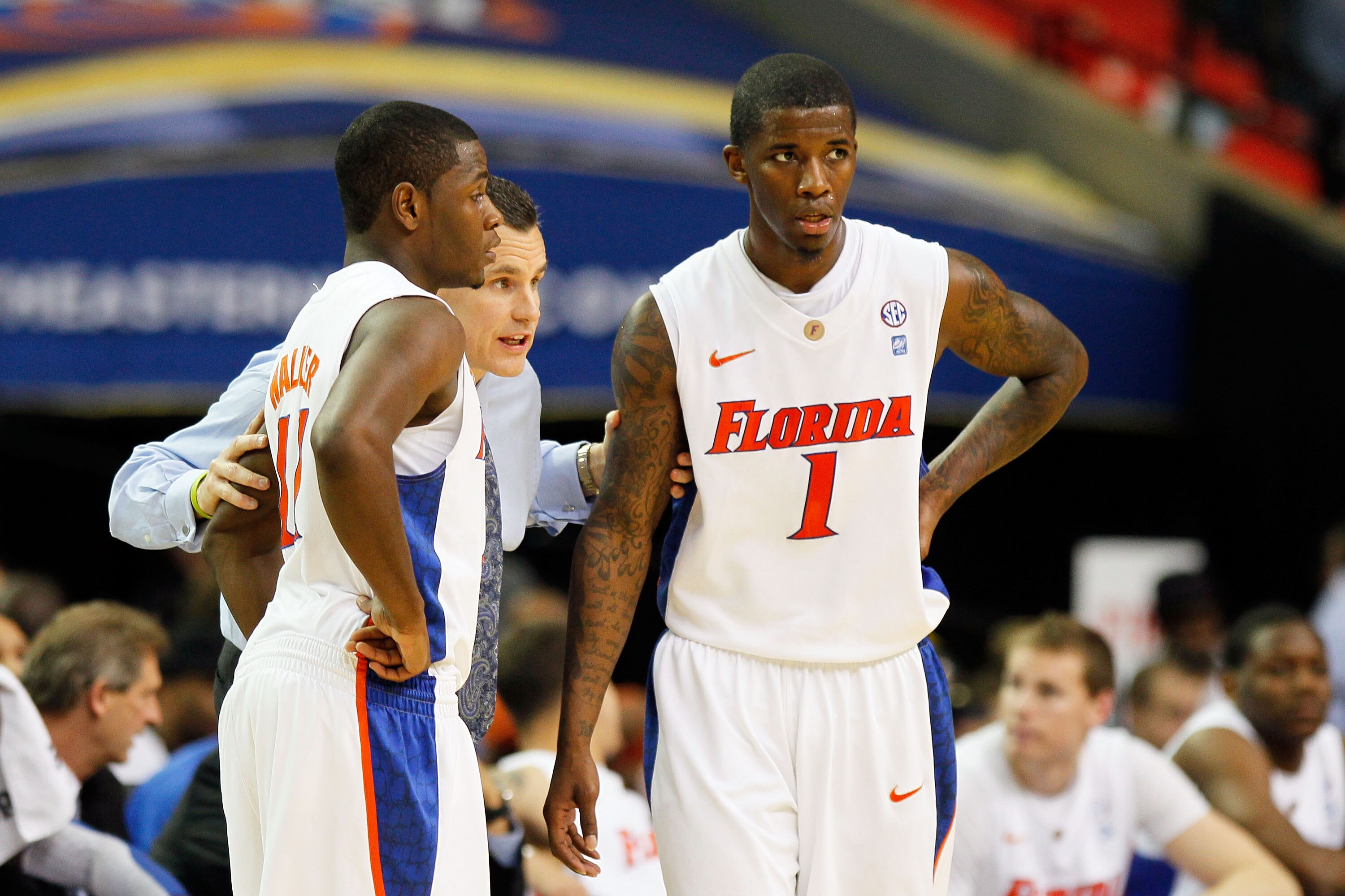 ATLANTA, GA - MARCH 12:  Head coach Billy Donovan talks to Kenny Boynton #1 and Erving Walker #11 of the Florida Gators during their 77 to 66 win over the Vanderbilt Commodores the semifinals of the SEC Men's Basketball Tournament at Georgia Dome on March