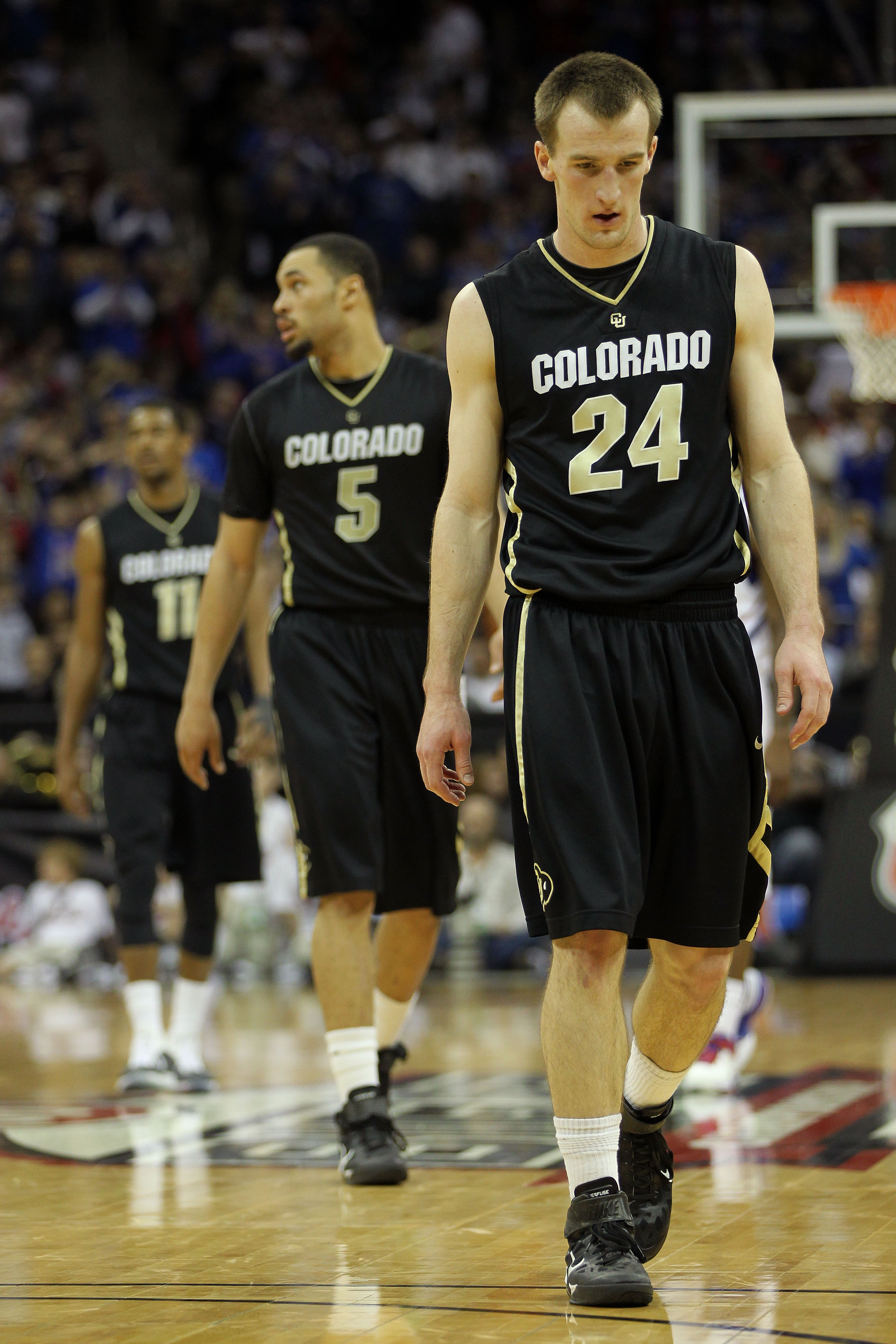 KANSAS CITY, MO - MARCH 11:  Levi Knutson #24, Marcus Relphorde #5 and Cory Higgins #11 of the Colorado Buffaloes walk on the court during their semifinal game against the Kansas Jayhawks in the 2011 Phillips 66 Big 12 Men's Basketball Tournament at Sprin