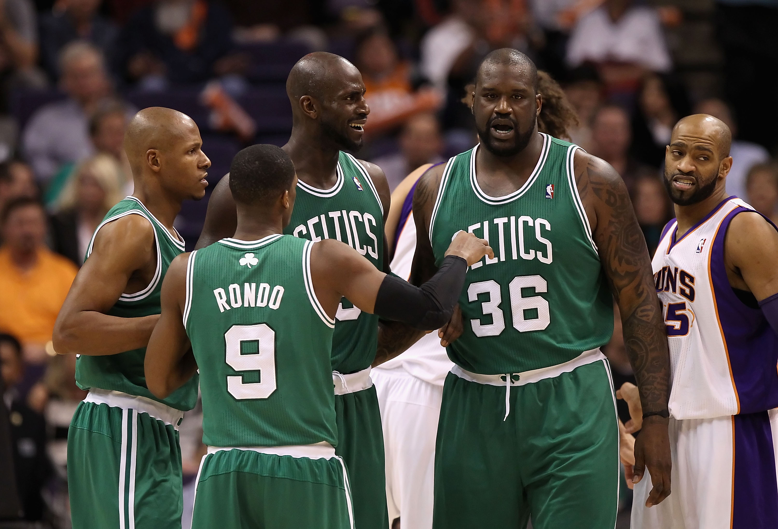 PHOENIX, AZ - JANUARY 28:  Ray Allen #20, Rajon Rondo #9, Kevin Garnett #5 and Shaquille O'Neal #36 of the Boston Celtics huddle up during the NBA game against the Phoenix Suns at US Airways Center on January 28, 2011 in Phoenix, Arizona.   The Suns defea