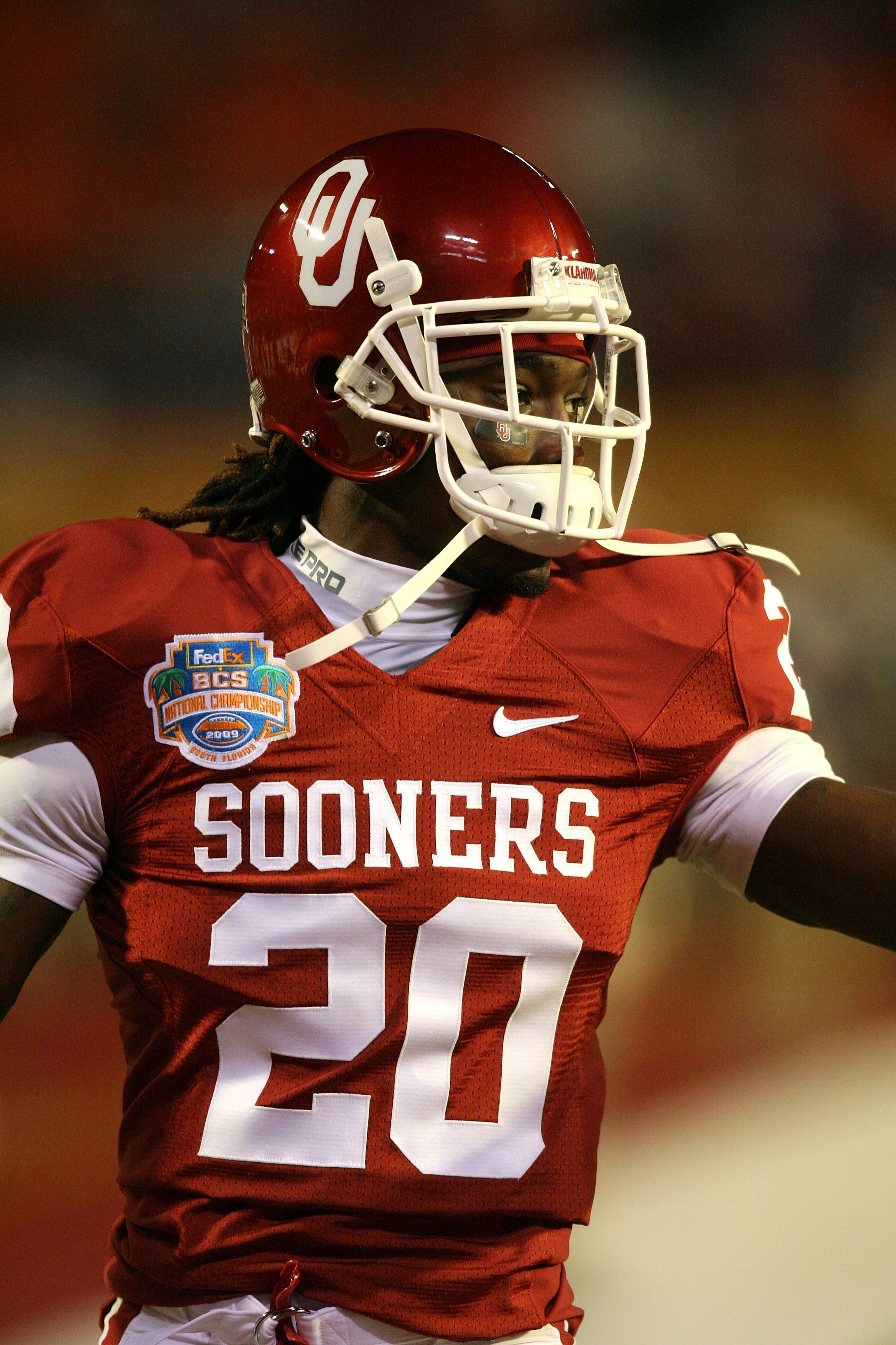MIAMI - JANUARY 08: Quinton Carter #20 of the Oklahoma Sooners looks on during warm ups against the Florida Gators during the FedEx BCS National Championship game at Dolphin Stadium on January 8, 2009 in Miami, Florida. (Photo by Doug Benc/Getty Images) MIAMI - JANUARY 08: Quinton Carter #20 of the Oklahoma Sooners looks on during warm ups against the Florida Gators during the FedEx BCS National Championship game at Dolphin Stadium on January 8, 2009 in Miami, Florida. (Photo by Doug Benc/Getty Images)