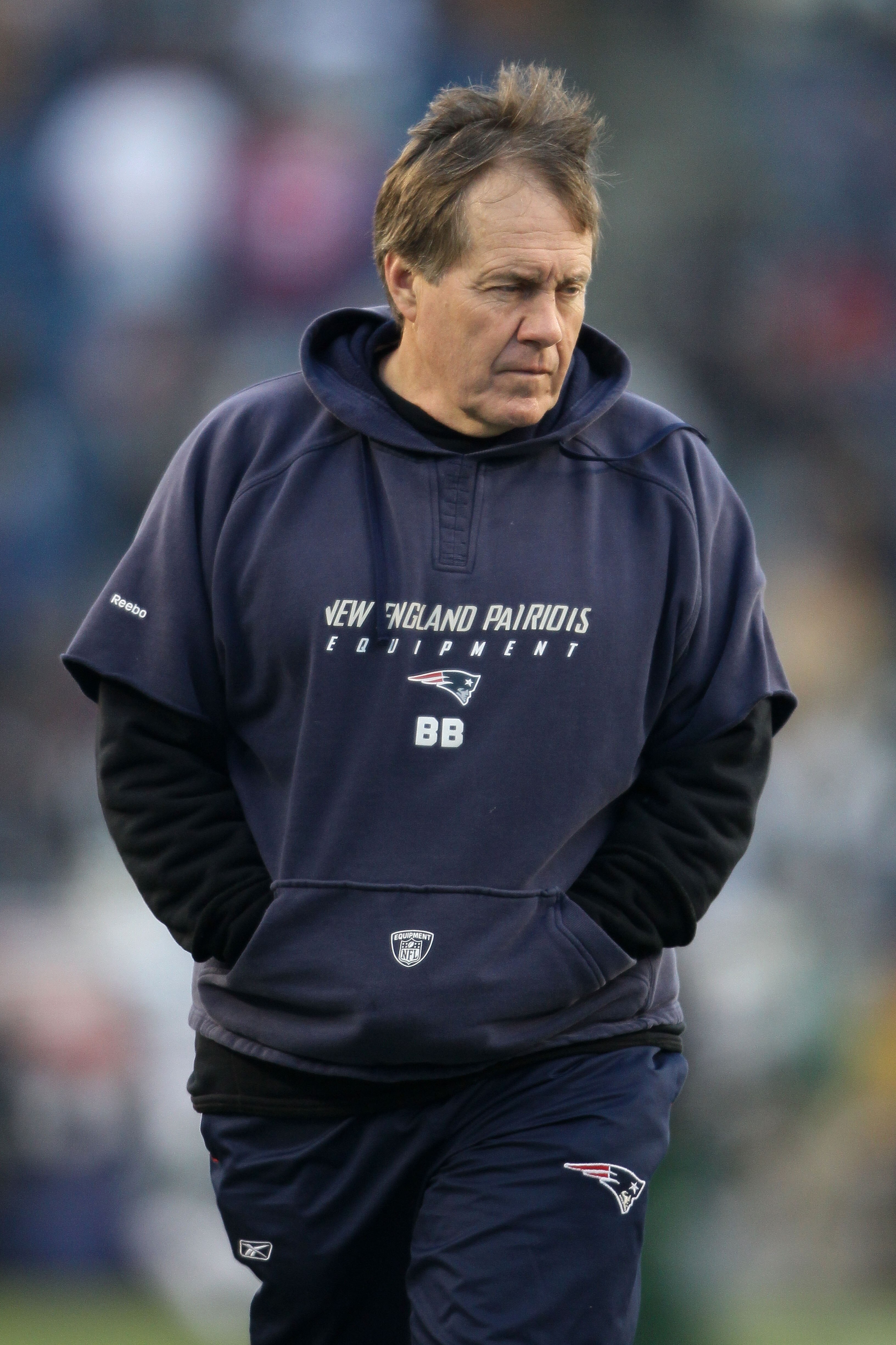 FOXBORO, MA - JANUARY 16: Head coach Bill Belichick of the New England Patriots stands on the field during their 2011 AFC divisional playoff game against the New York Jets at Gillette Stadium on January 16, 2011 in Foxboro, Massachusetts. (Photo by Elsa FOXBORO, MA - JANUARY 16: Head coach Bill Belichick of the New England Patriots stands on the field during their 2011 AFC divisional playoff game against the New York Jets at Gillette Stadium on January 16, 2011 in Foxboro, Massachusetts. (Photo by Elsa