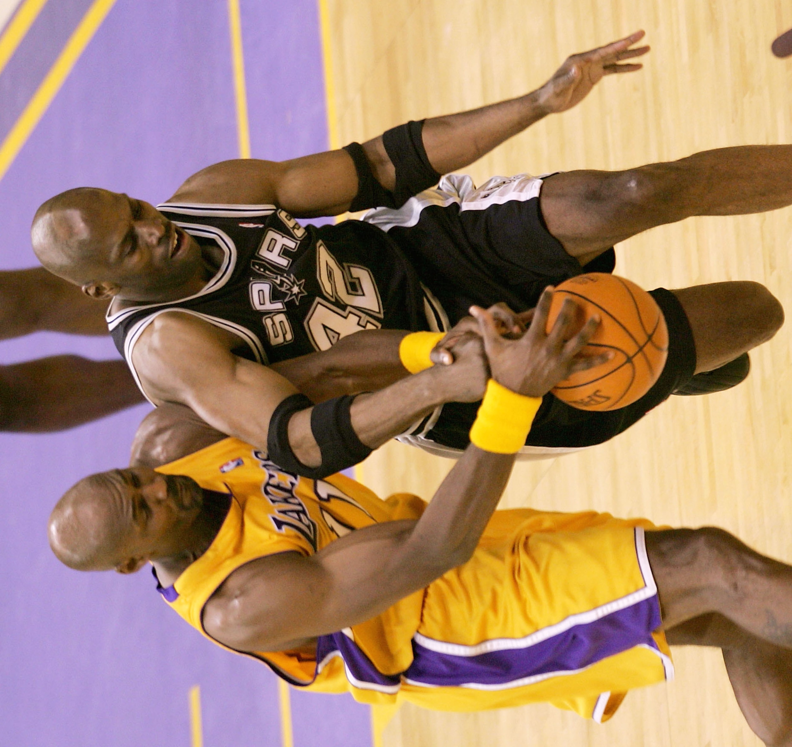 LOS ANGELES - MAY 15:  Karl Malone #11 of the Los Angeles Lakers and Kevin Willis #42 of the San Antonio Spurs during Game six of the Western Conference Semifinals during the 2004 NBA Playoffs at Staples Center on May 15, 2004 in Los Angeles, California.