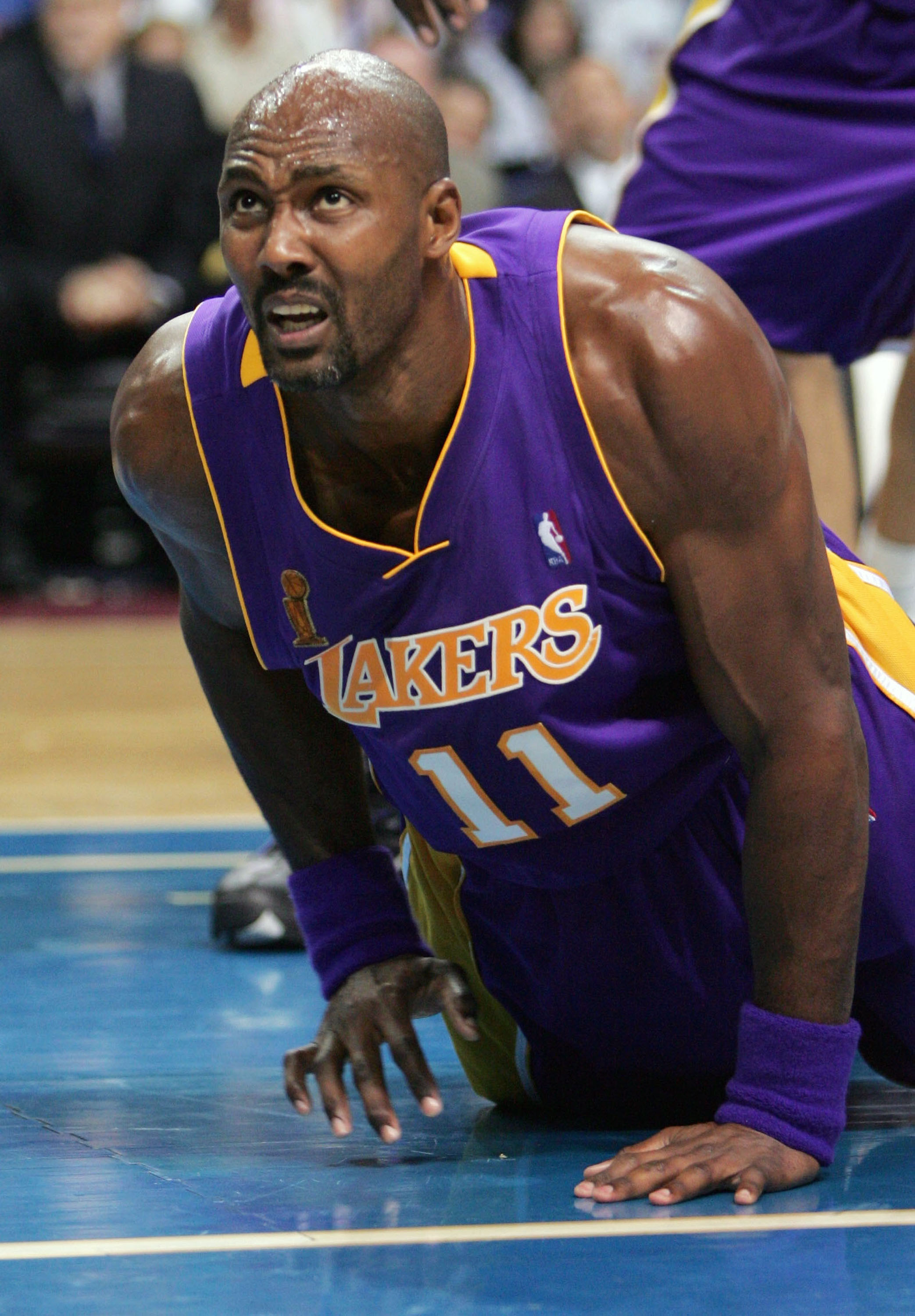 AUBURN HILLS, MI - JUNE 10:  Karl Malone #11 of the Los Angeles Lakers reacts after a play against the Detroit Pistons during the second quarter of game three of the 2004 NBA Finals June 10, 2004 at The Palace of Auburn Hills in Auburn Hills, Michigan.  N