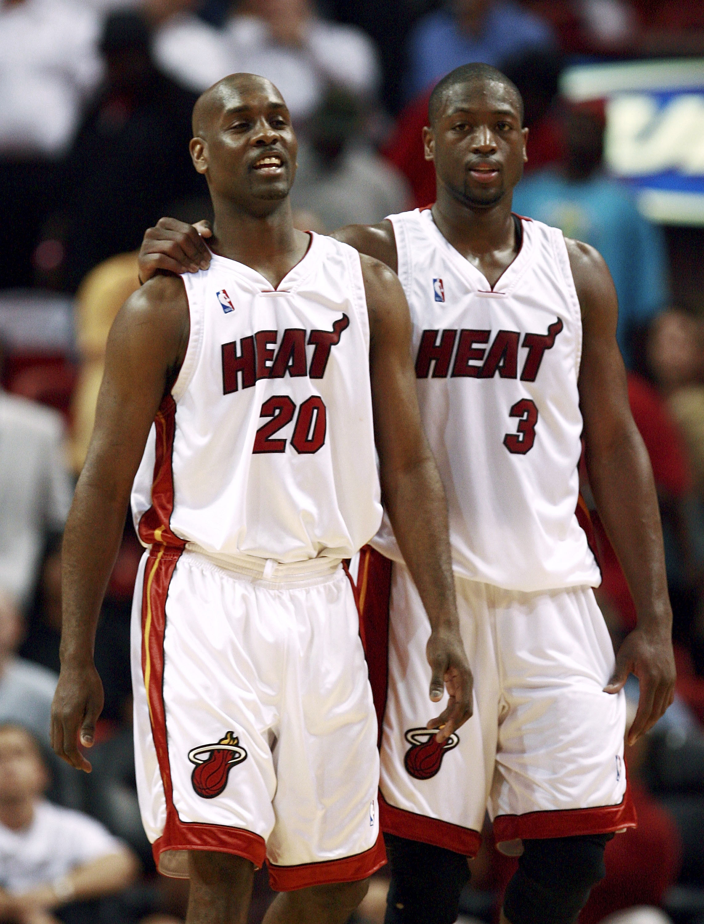 MIAMI - FEBRUARY 01:  Dwyane Wade #3 of the Miami Heat puts his arm around Gary Payton #20 late in the fourth quarter against the Cleveland Cavaliers at American Airlines Arena February 1, 2007 in Miami, Florida.The Heat defeated the Cavaliers, 92-89. NOT