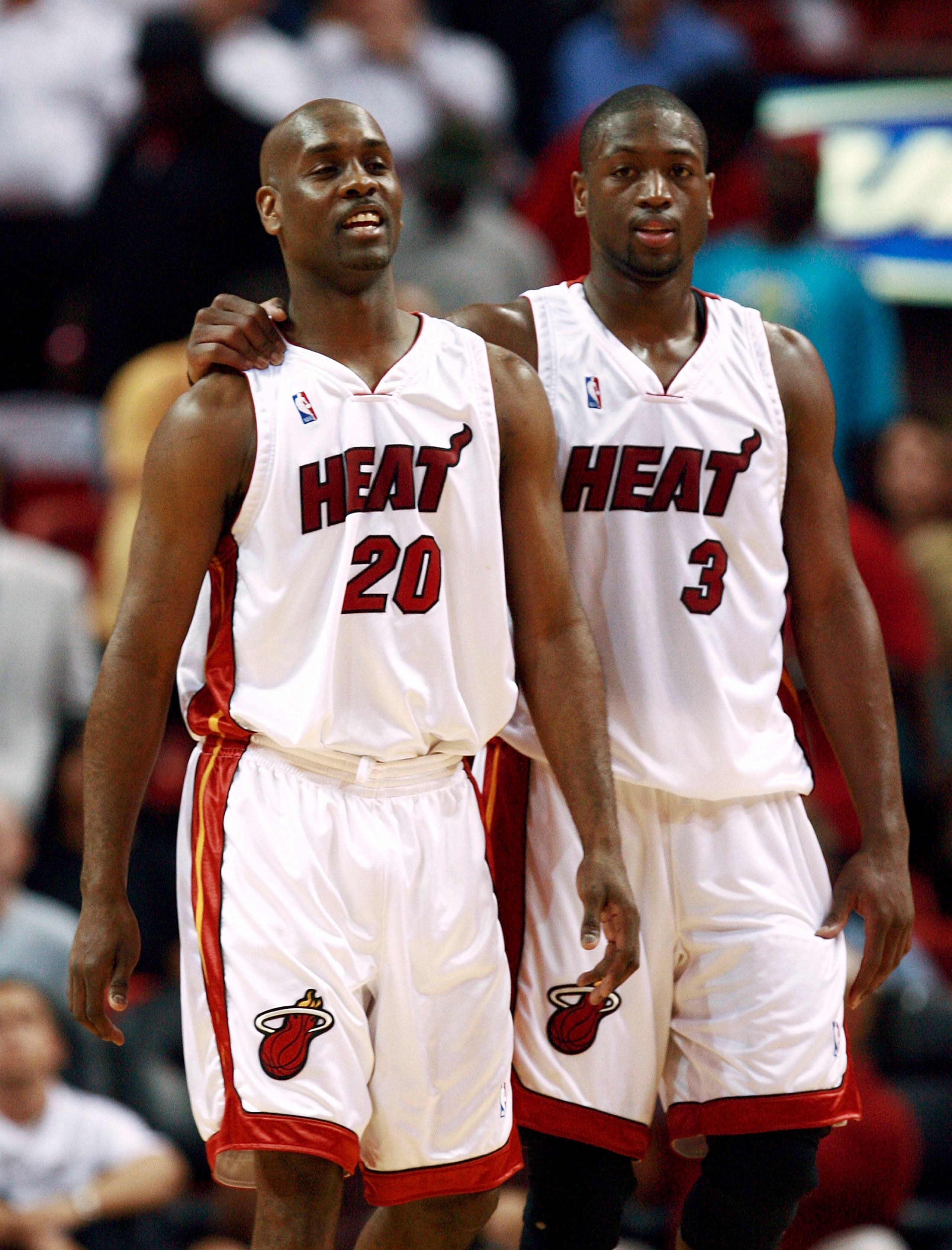 MIAMI - FEBRUARY 01:  Dwyane Wade #3 of the Miami Heat puts his arm around Gary Payton #20 late in the fourth quarter against the Cleveland Cavaliers at American Airlines Arena February 1, 2007 in Miami, Florida.The Heat defeated the Cavaliers, 92-89. NOT