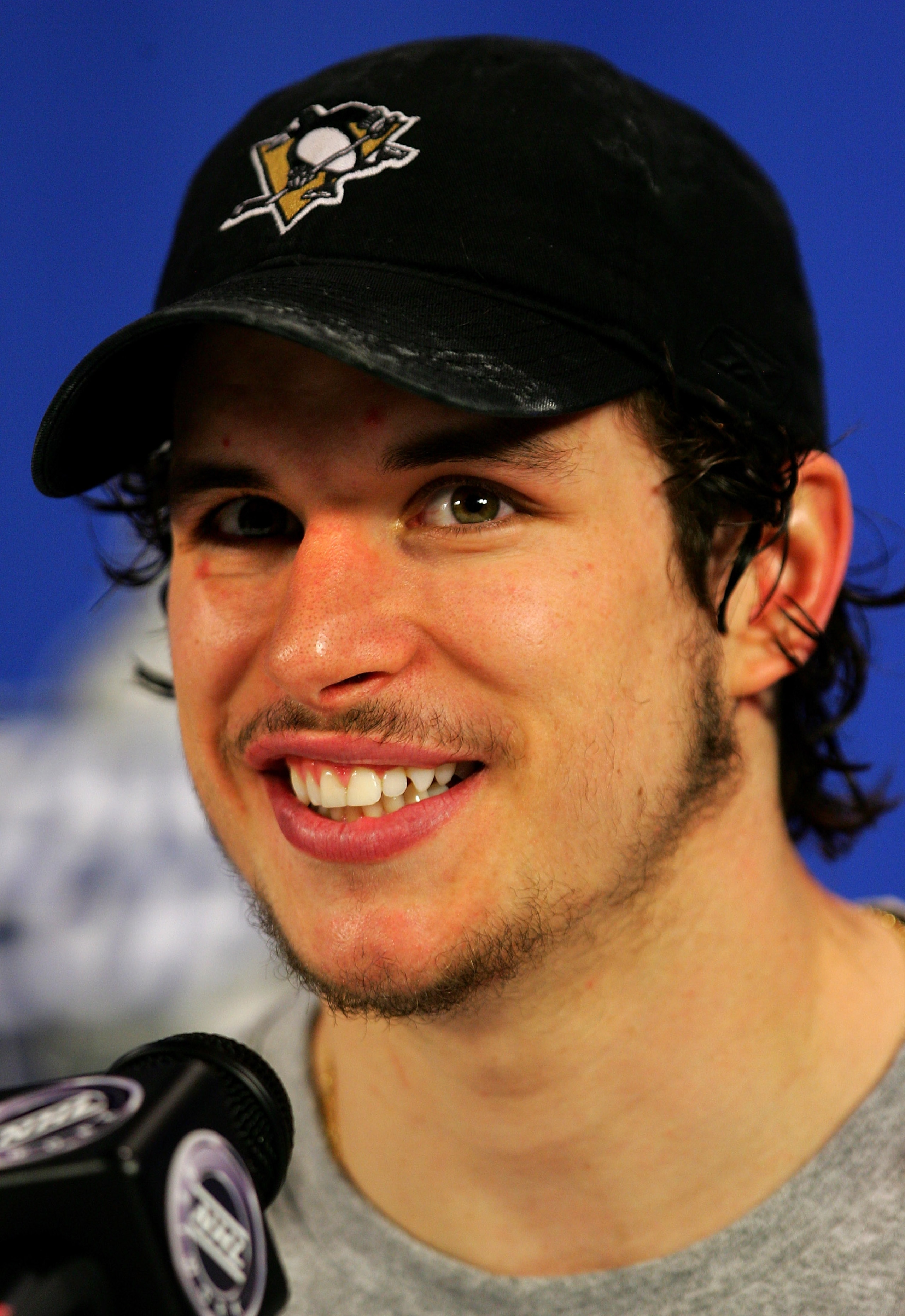 PITTSBURGH - MAY 18:  Sidney Crosby #87 of the Pittsburgh Penguins smiles during his post-game press conference after his team's victory over the Philadelphia Flyers 6-0 to win game five of the Eastern Conference Finals of the 2008 NHL Stanley Cup Playoff