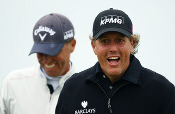 SANDWICH, ENGLAND - JULY 13:  Phil Mickelson (R) of the USA enjoys a joke during the final practice round during The Open Championship at Royal St. George's on July 13, 2011 in Sandwich, England. The 140th Open begins on July 14, 2011..  (Photo by Richard