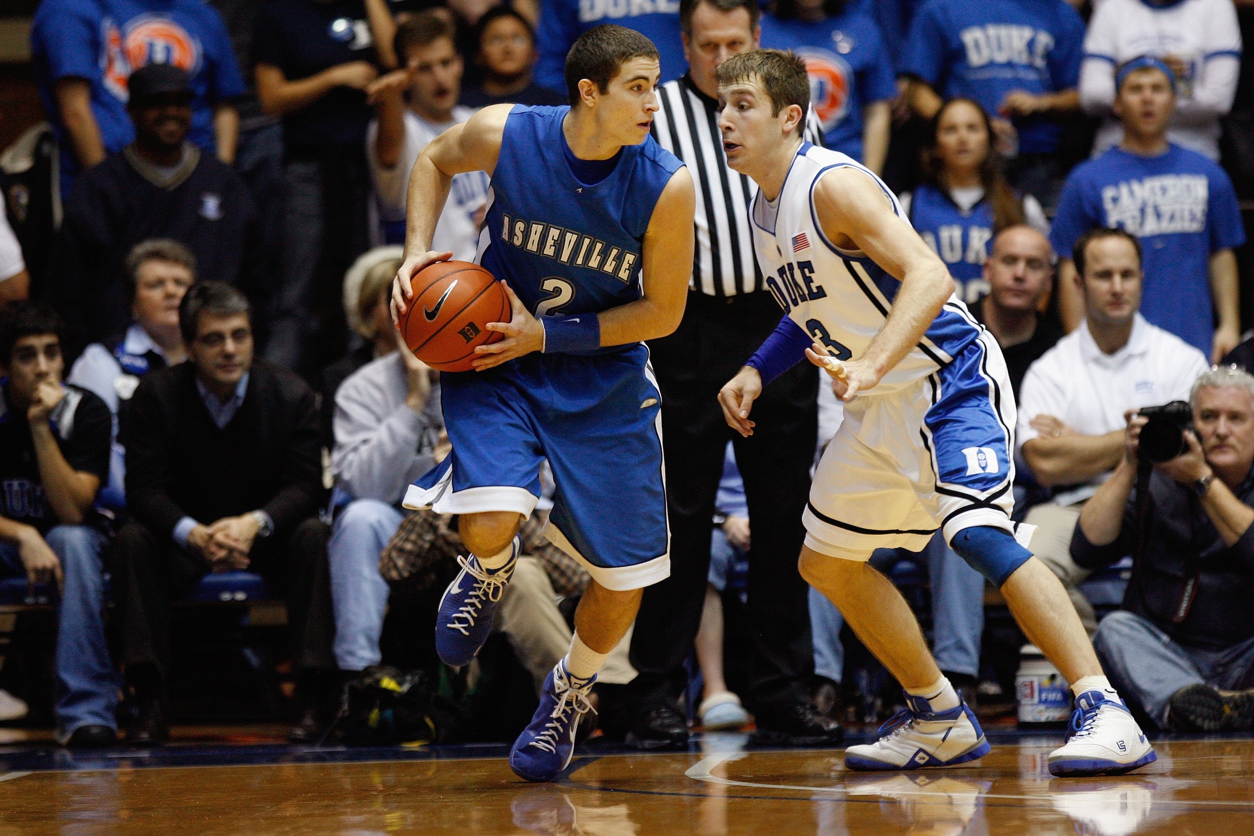 DURHAM, NC - DECEMBER 17:  Greg Paulus #3 of the Duke Blue Devils defends against Matt Dickey #2 of the North Carolina Asheville Bulldogs on December 17, 2008 at Cameron Indoor Stadium in Durham, North Carolina. (Photo by Kevin C. Cox/Getty Images)