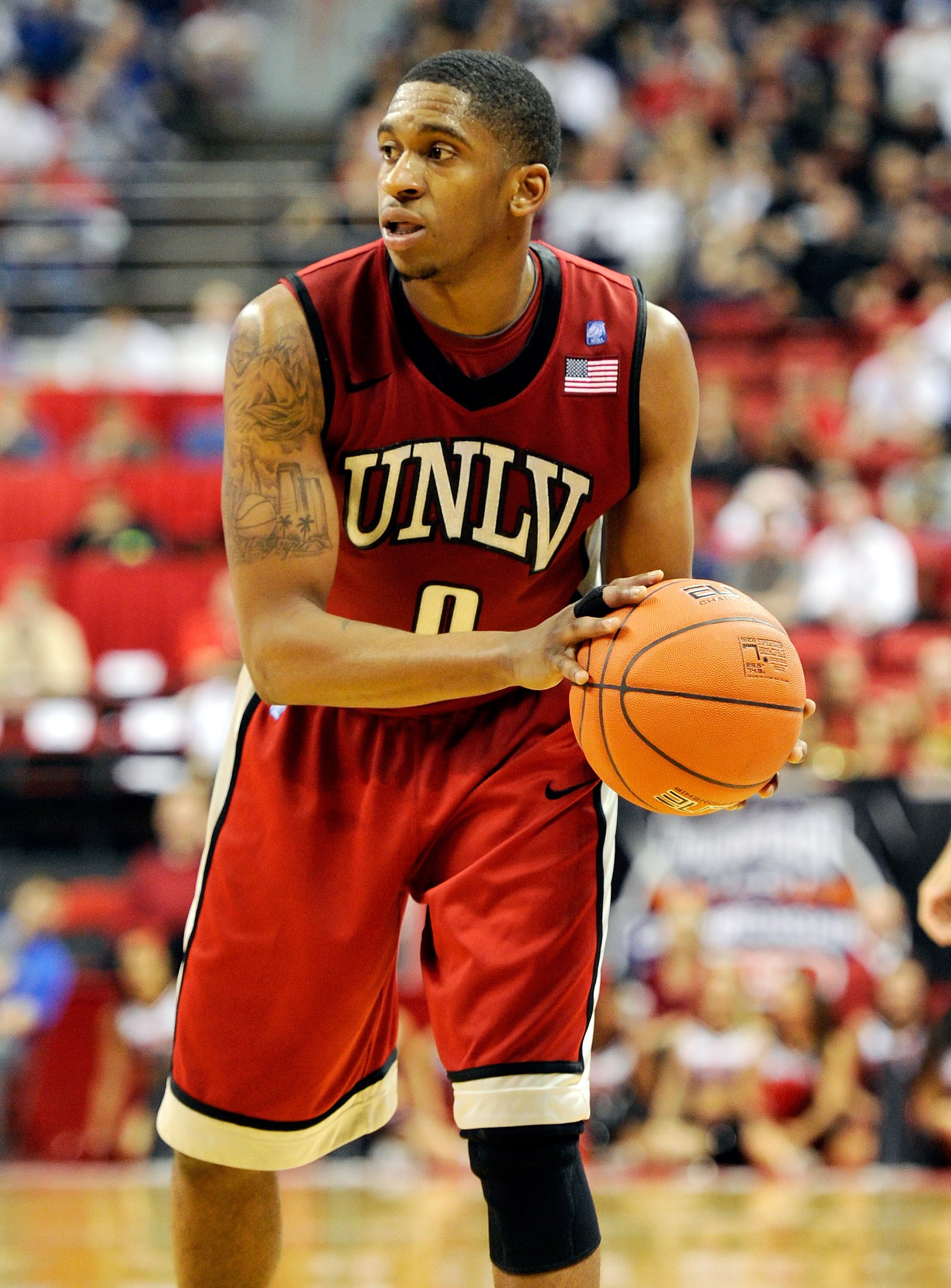 LAS VEGAS, NV - MARCH 11:  Oscar Bellfield #0 of the UNLV Rebels looks to pass during a semifinal game of the Conoco Mountain West Conference Basketball tournament against the San Diego State Aztecs at the Thomas & Mack Center March 11, 2011 in Las Vegas,