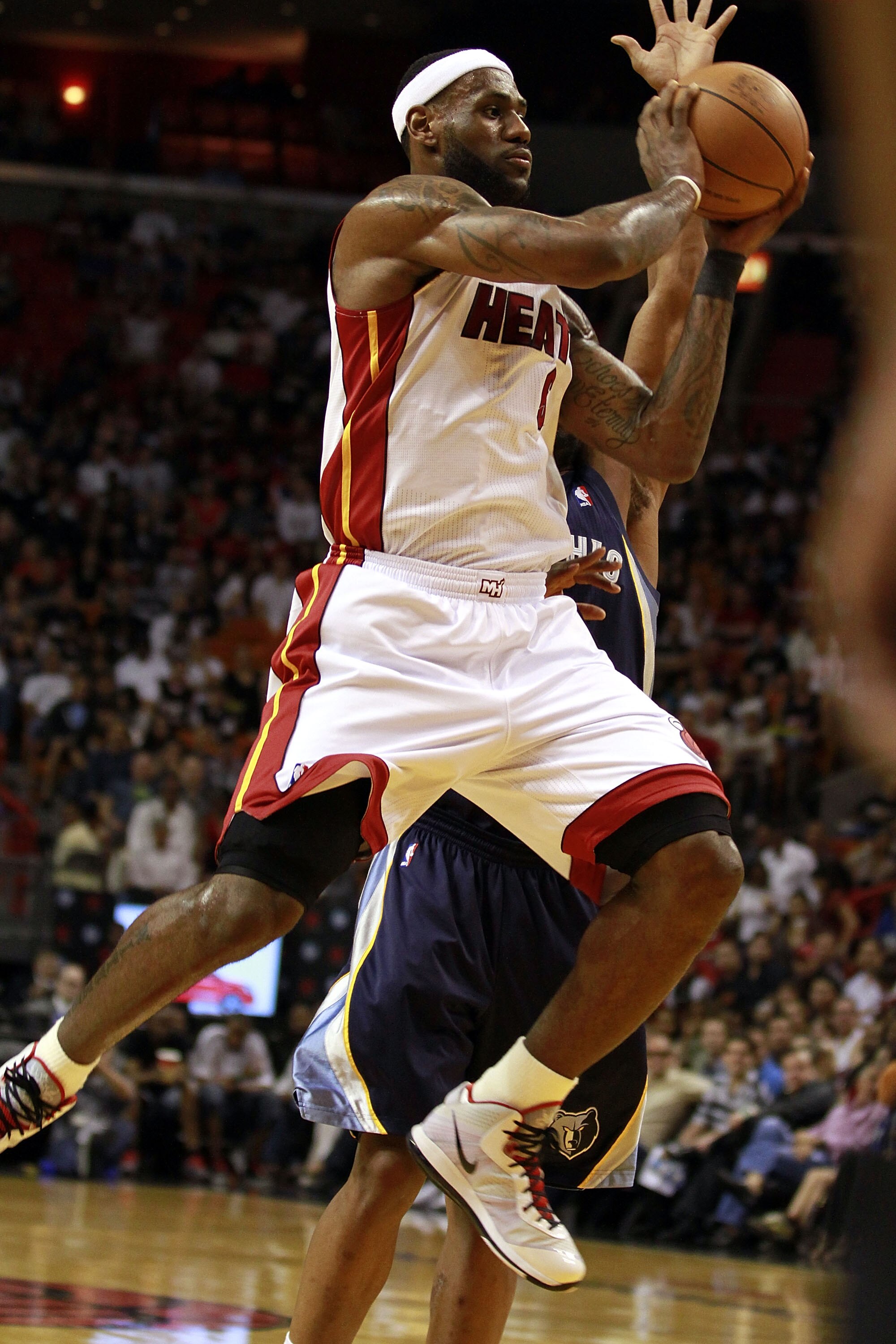MIAMI - MARCH 12:  Forward LeBron James #6 of the Miami Heat drives against the Memphis Grizzlies at American Airlines Arena on March 12, 2011 in Miami, Florida. NOTE TO USER: User expressly acknowledges and agrees that, by downloading and/or using this P