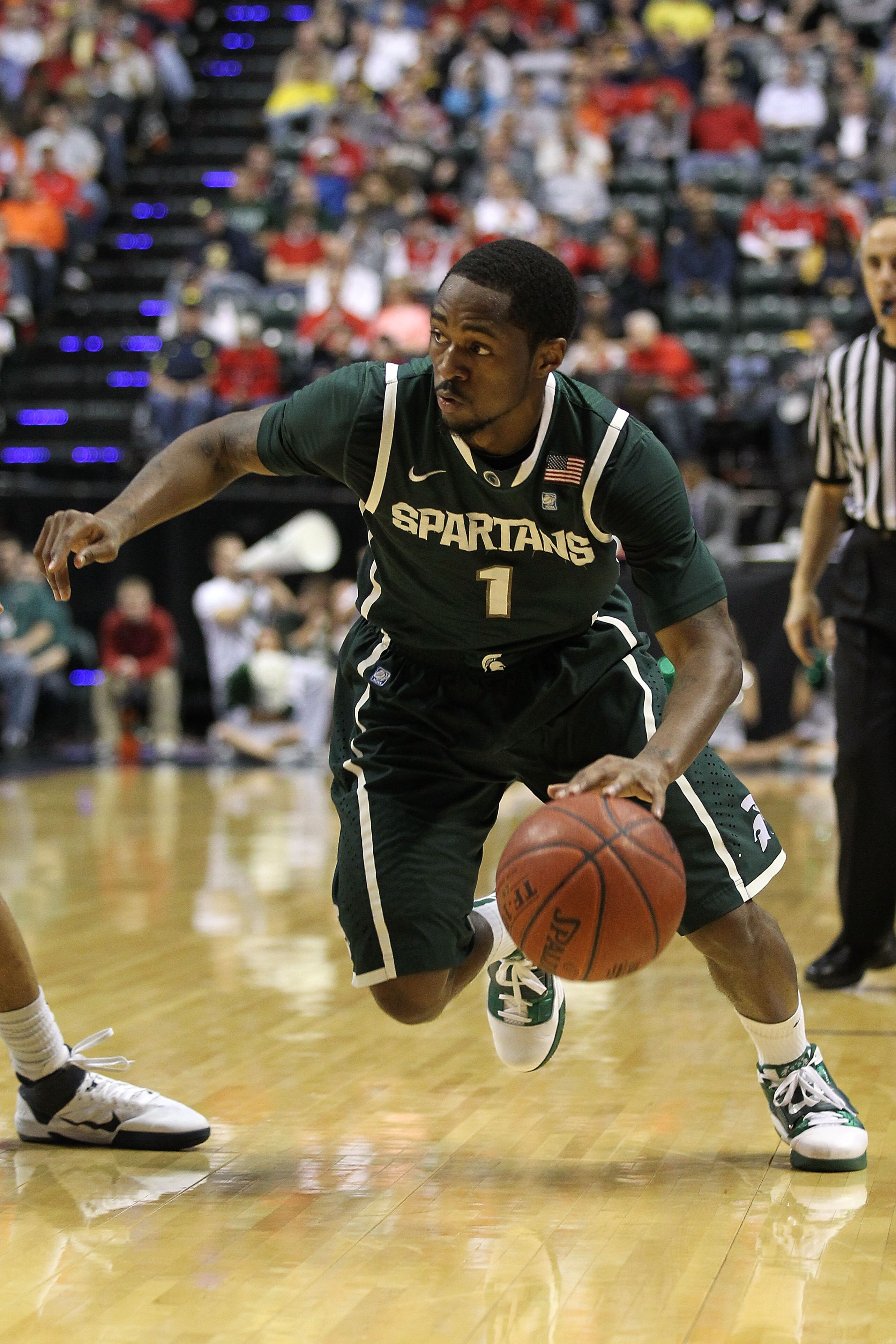 INDIANAPOLIS, IN - MARCH 12:  Kalin Lucas #1 of the Michigan State Spartans drives against Penn State Nittany Lions during the semifinals of the 2011 Big Ten Men's Basketball Tournament at Conseco Fieldhouse on March 12, 2011 in Indianapolis, Indiana.  (P