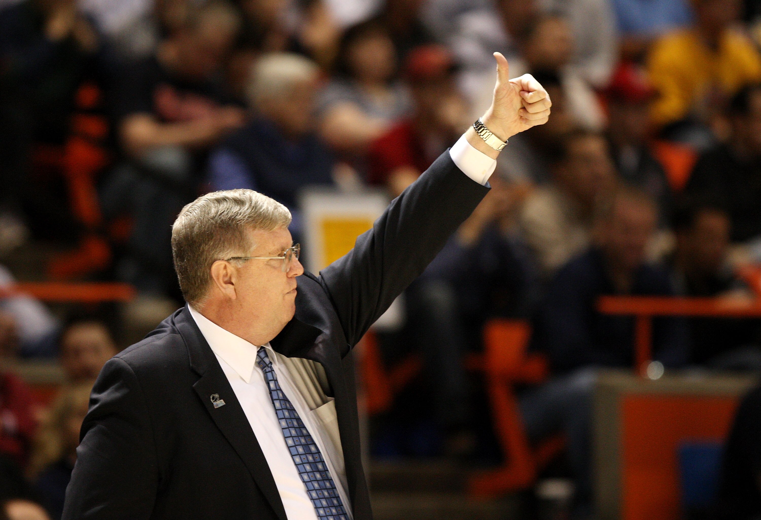 BOISE, ID - MARCH 20:  Head Coach Stew Morrill of the Utah State Aggies adjusts his team during the game against the Marquette Golden Eagles in the first round of the NCAA Division I Men's Basketball Tournament at the Taco Bell Arena on March 20, 2009 in