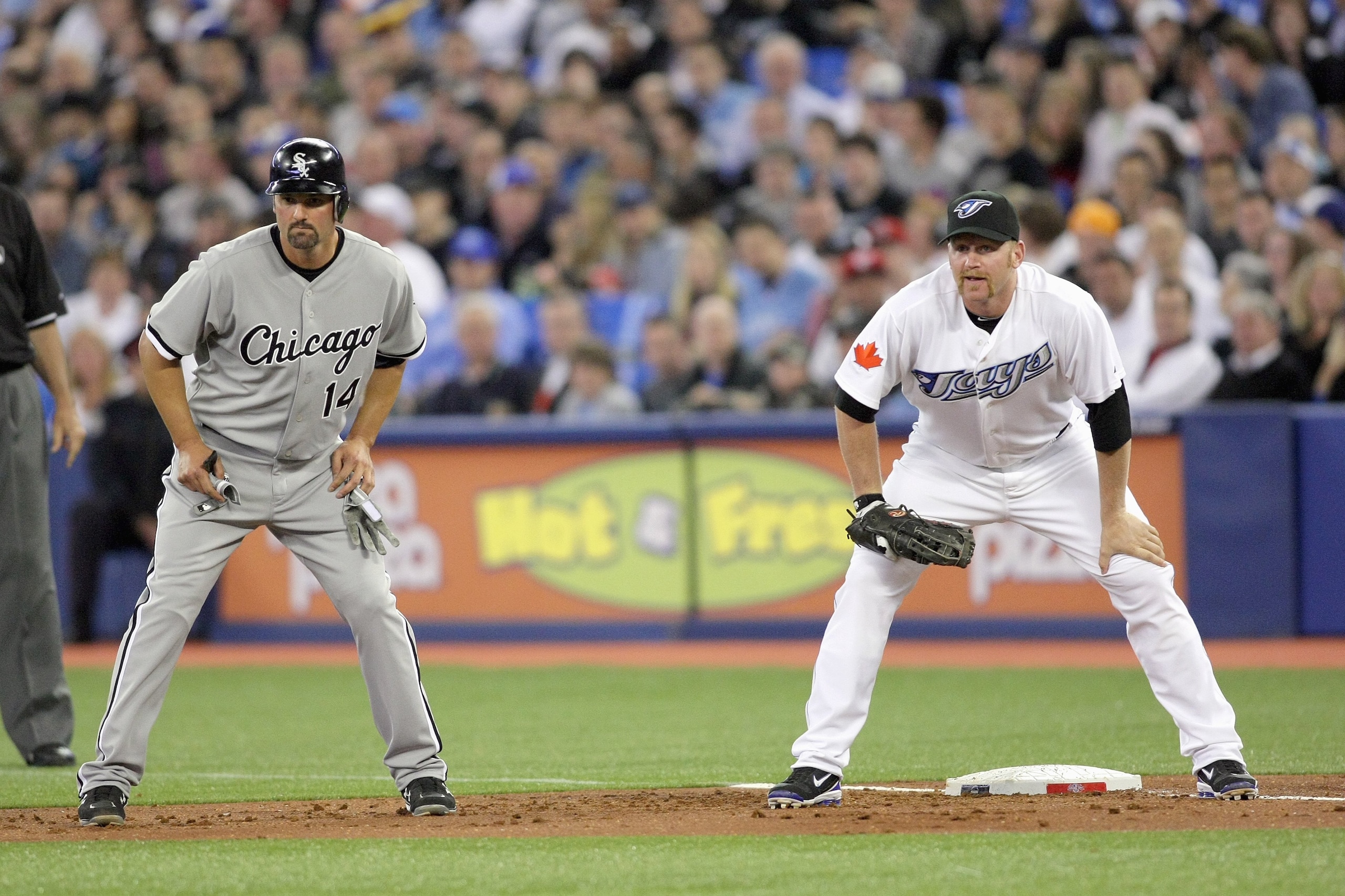 TORONTO - APRIL 12:  Lyle Overbay #35 of the Toronto Blue Jays waits at first base as Paul Konerko of the Chicago White Sox leads off during the game at the Rogers Centre on April 12, 2010 in Toronto, Ontario. (Photo By Dave Sandford/Getty Images)