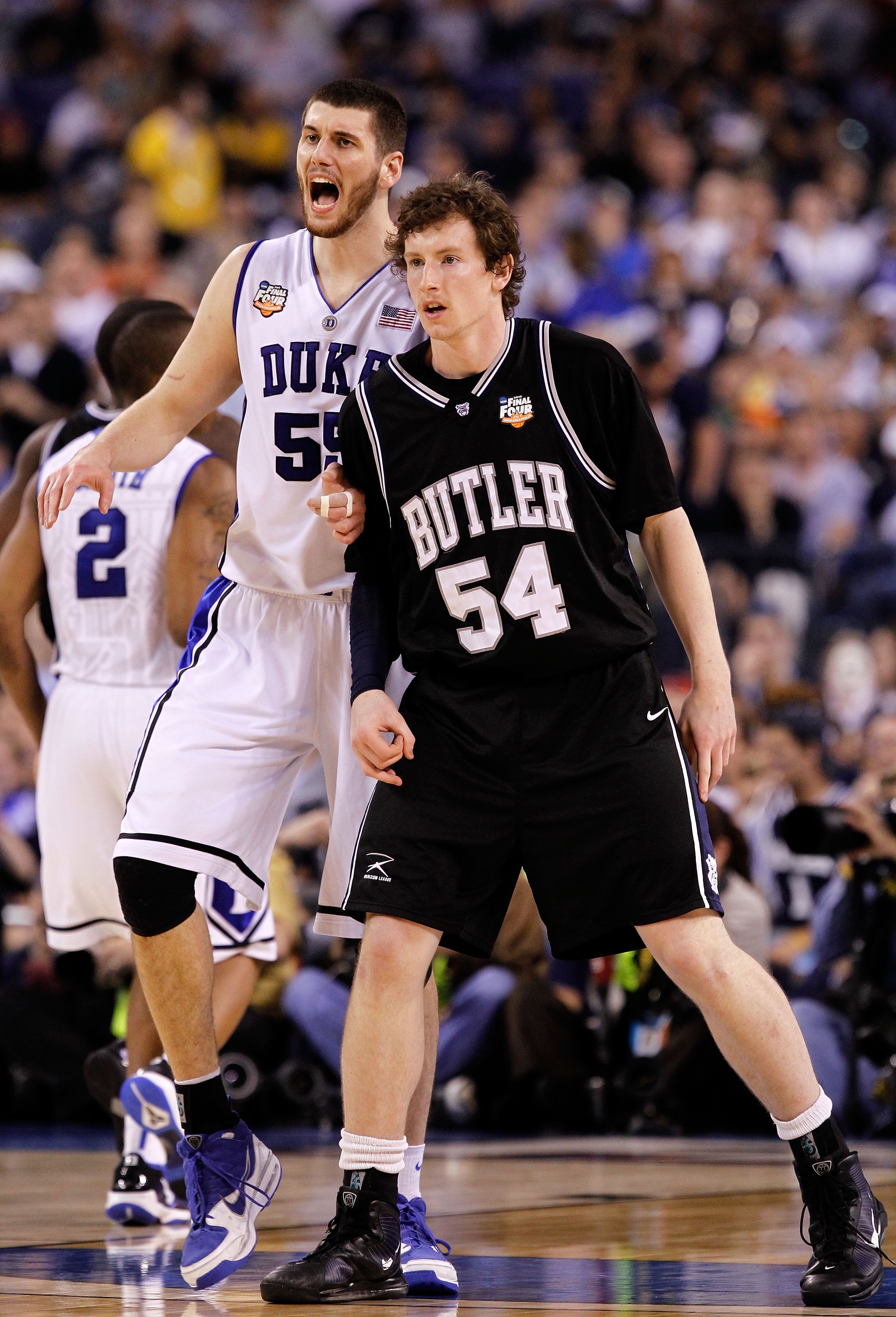INDIANAPOLIS - APRIL 05:  Brian Zoubek #55 of the Duke Blue Devils reacts as he matches up against Matt Howard #54 of the Butler Bulldogs during the 2010 NCAA Division I Men's Basketball National Championship game at Lucas Oil Stadium on April 5, 2010 in 