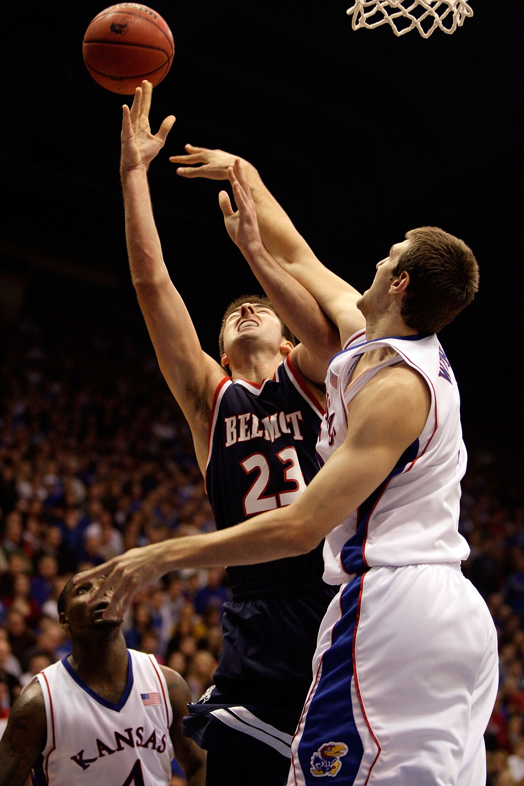 LAWRENCE, KS - DECEMBER 29: Scott Saunders #23 of the Belmont Bruins is fouled by Jeff Withey #5 of the Kansas Jayhawks during the game on December 29, 2009 at Allen Fieldhouse in Lawrence, Kansas. (Photo by Jamie Squire/Getty Images) LAWRENCE, KS - DECEMBER 29: Scott Saunders #23 of the Belmont Bruins is fouled by Jeff Withey #5 of the Kansas Jayhawks during the game on December 29, 2009 at Allen Fieldhouse in Lawrence, Kansas. (Photo by Jamie Squire/Getty Images)