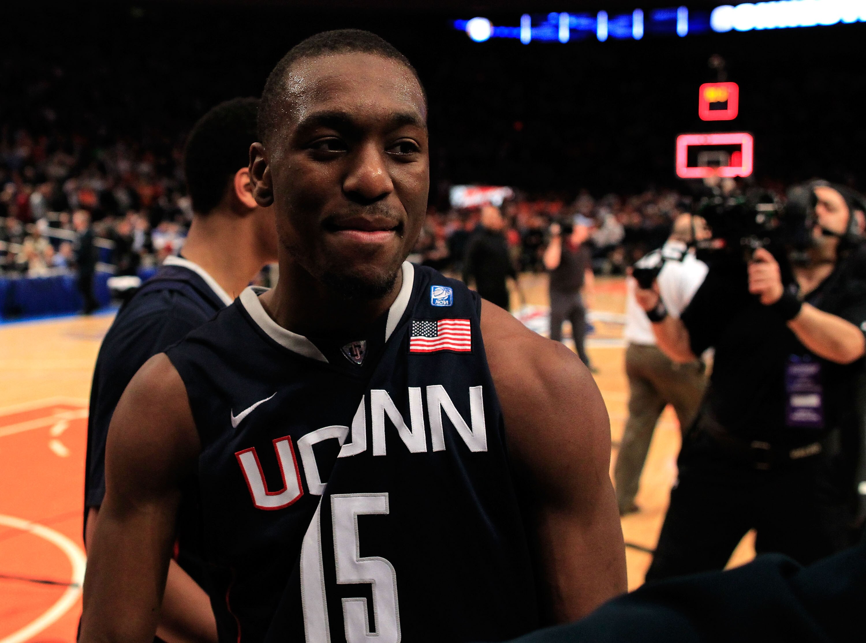 NEW YORK, NY - MARCH 10: Kemba Walker #15 of the Connecticut Huskies walks off the court after making the game winning basket against the Pittsburgh Panthers during the quarterfinals of the 2011 Big East Men's Basketball Tournament presented by American E
