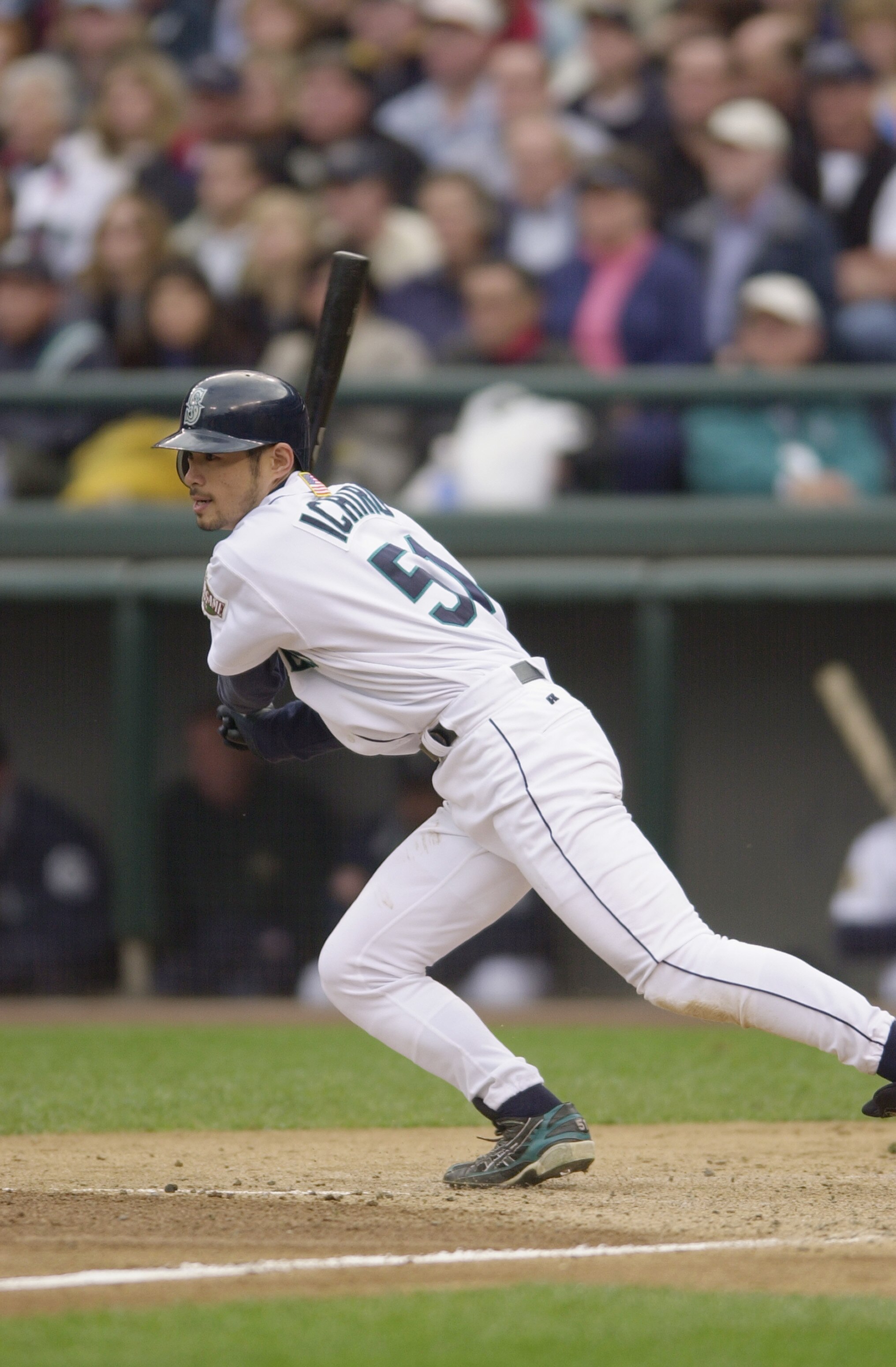 SEATTLE - OCTOBER 15:  Ichiro Suzuki #52 of the Seattle Mariners makes his way to first base during Game 2 of the American League Division Series against the Cleveland Indians on October 15, 2001 at Safeco Field in Seattle, Washington.  The Mariners won 5