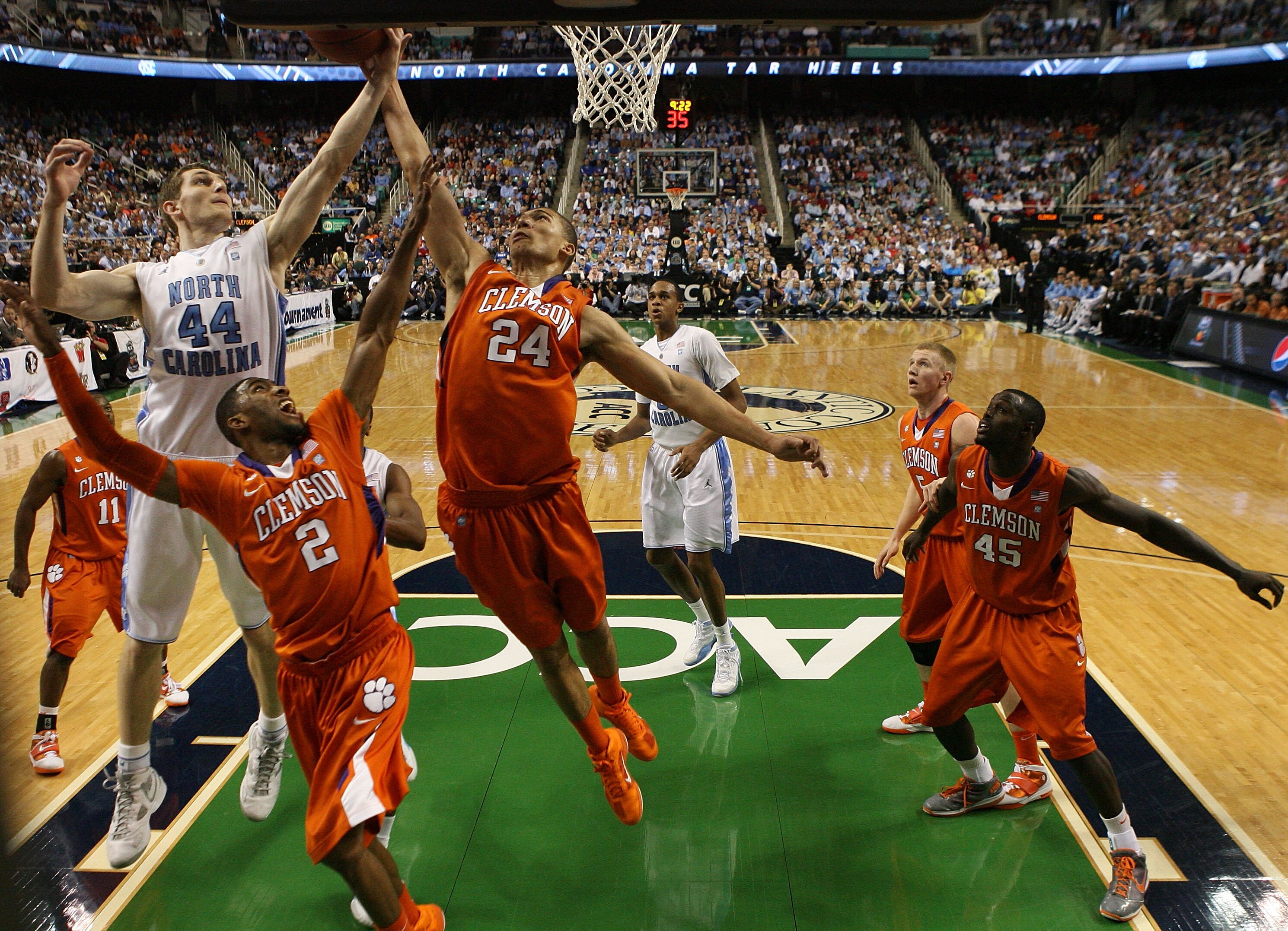 GREENSBORO, NC - MARCH 12: Tyler Zeller #44 of the North Carolina Tar Heels rebounds against Demontez Stitt #2 and Milton Jennings #24 of the Clemson Tigers during the first half in the semifinals of the 2011 ACC men's basketball tournament at the Greens GREENSBORO, NC - MARCH 12: Tyler Zeller #44 of the North Carolina Tar Heels rebounds against Demontez Stitt #2 and Milton Jennings #24 of the Clemson Tigers during the first half in the semifinals of the 2011 ACC men's basketball tournament at the Greens