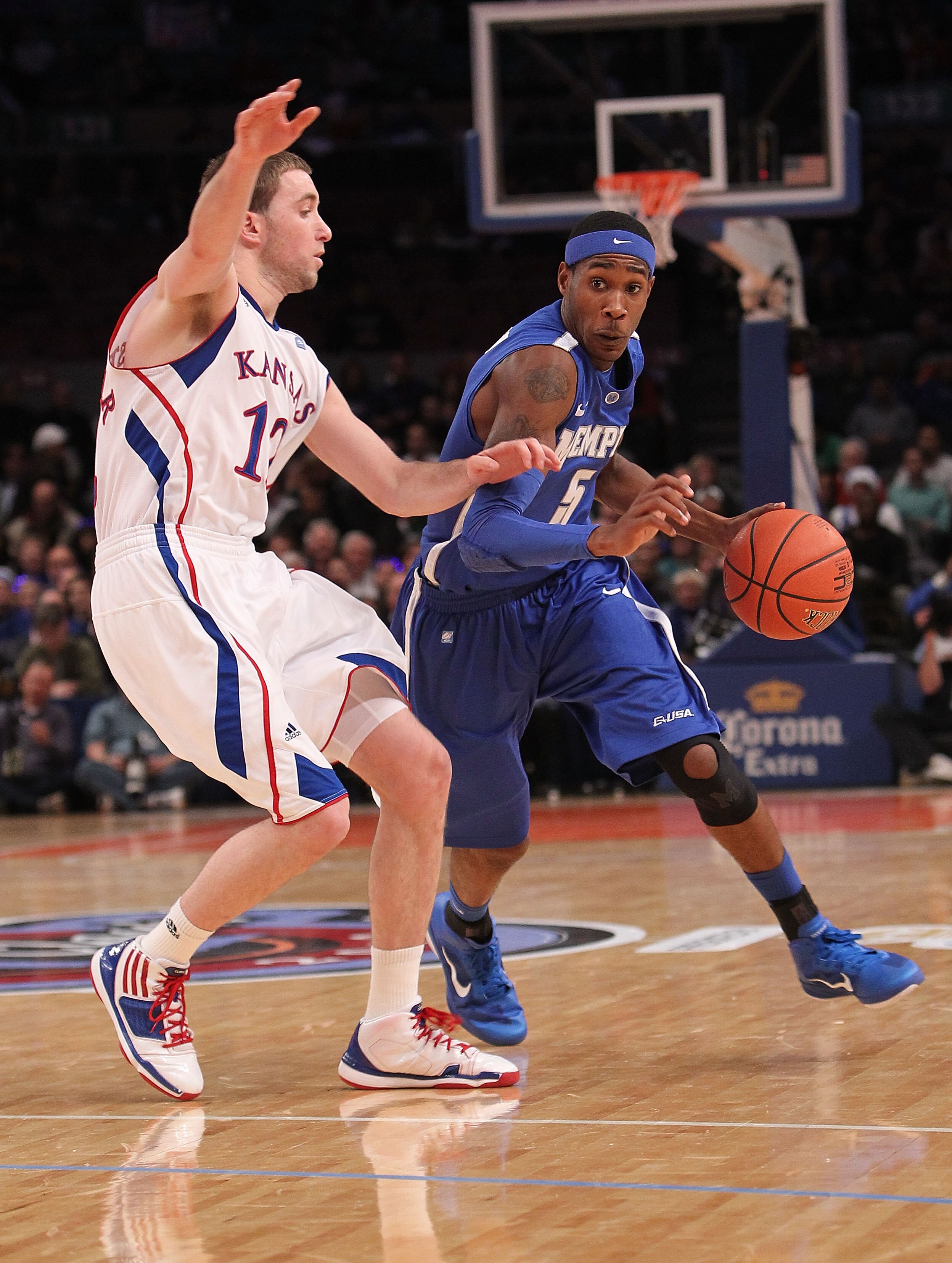 NEW YORK, NY - DECEMBER 07: Will Barton #5 of the Memphis Tigers drives to the basket against Brady Morningstar #12 of the Kansas Jayhawks during their game at the Jimmy V Classic at Madison Square Garden on December 7, 2010 in New York City. (Photo by NEW YORK, NY - DECEMBER 07: Will Barton #5 of the Memphis Tigers drives to the basket against Brady Morningstar #12 of the Kansas Jayhawks during their game at the Jimmy V Classic at Madison Square Garden on December 7, 2010 in New York City. (Photo by