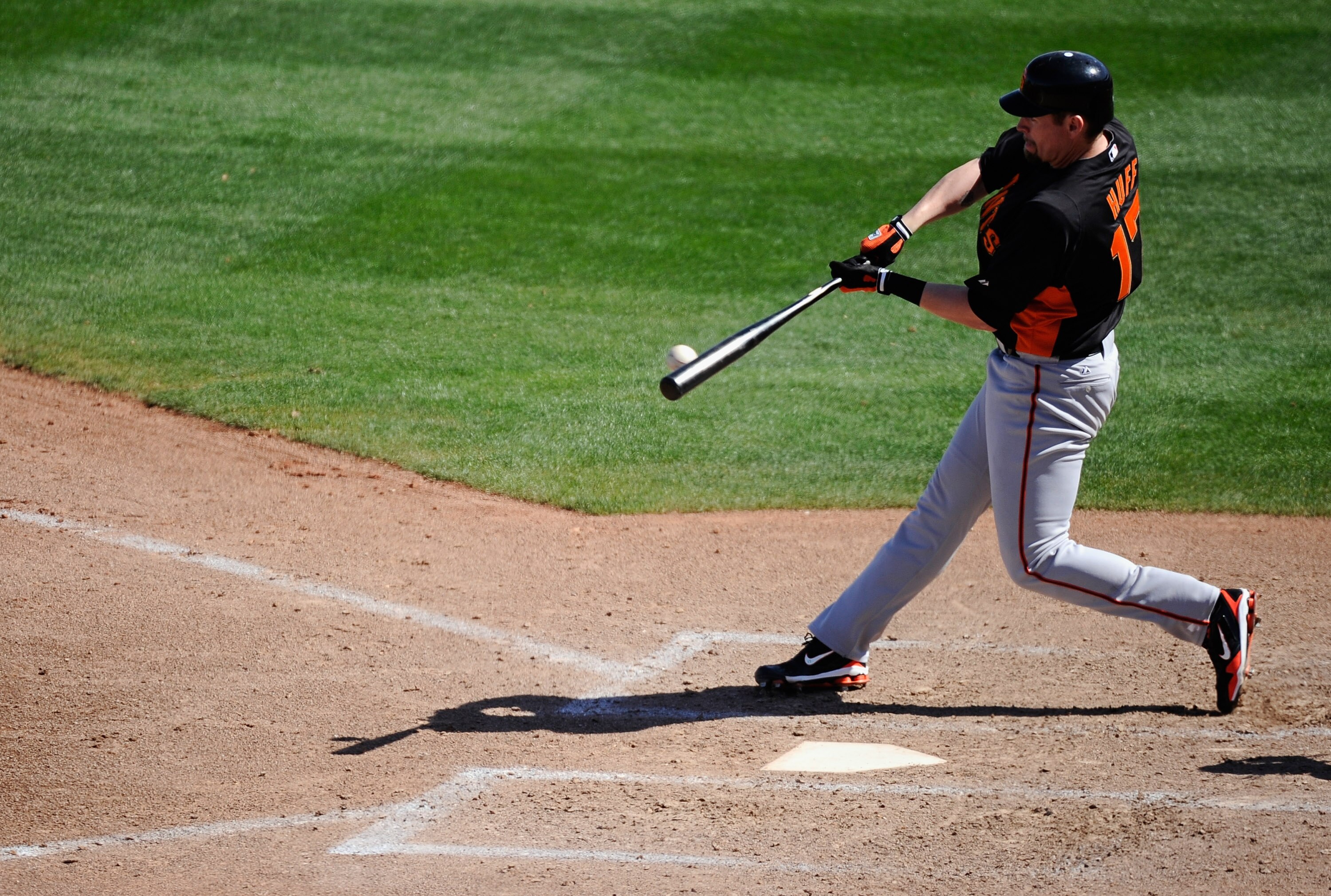 PEORIA, AZ - MARCH 08: Aubrey Huff #17 of the San Francisco Giants hits a deep fly out against Seattle Marinerr during the spring training baseball game against at Peoria Stadium on March 8, 2011 in Peoria, Arizona.  (Photo by Kevork Djansezian/Getty Imag
