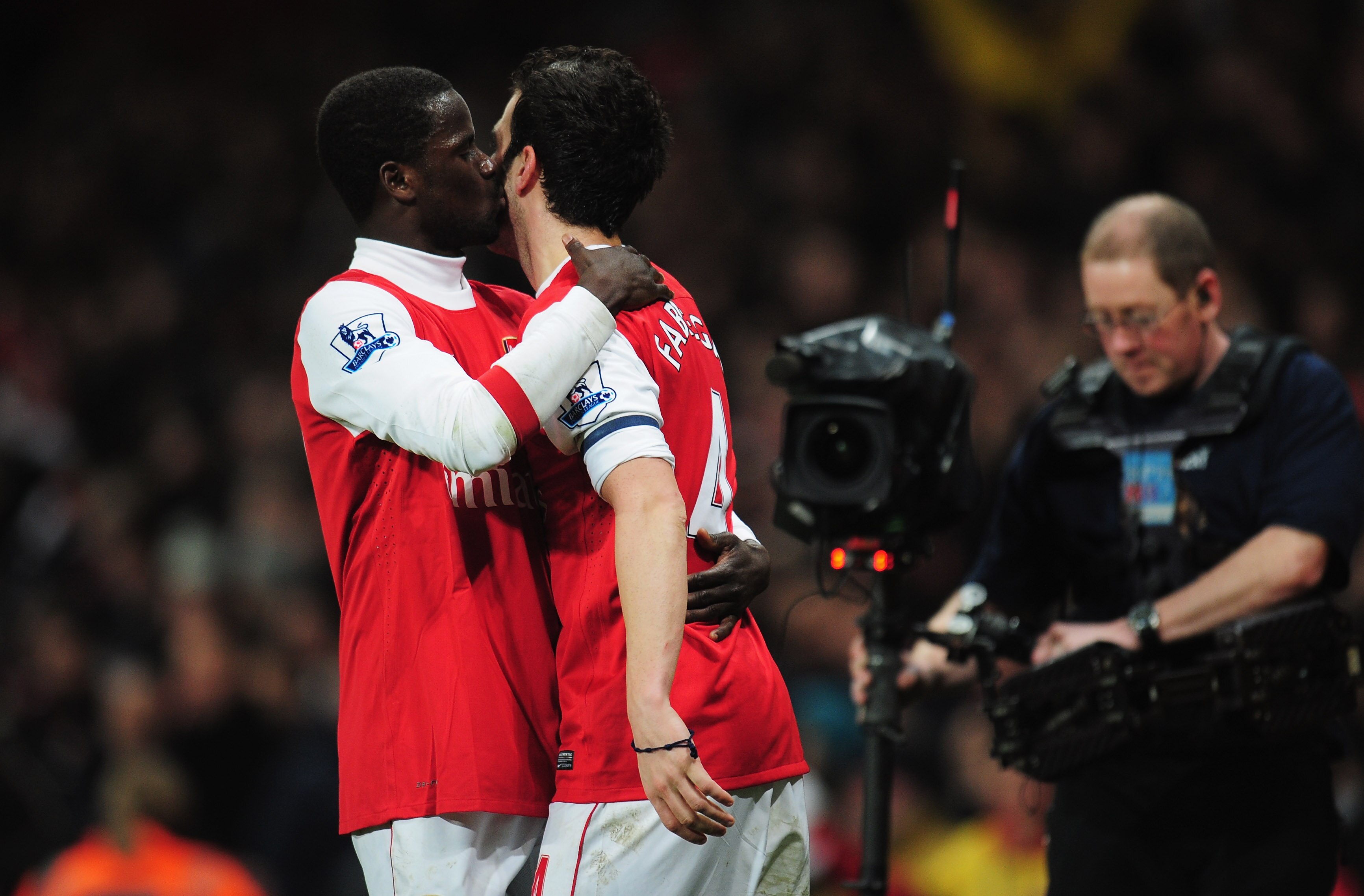 LONDON, ENGLAND - JANUARY 25:  Cesc Fabregas of Arsenal celebrates with Emmanuel Eboue as he scores their third goal during the Carling Cup Semi Final Second Leg match between Arsenal and Ipswich Town at Emirates Stadium on January 25, 2011 in London, Eng