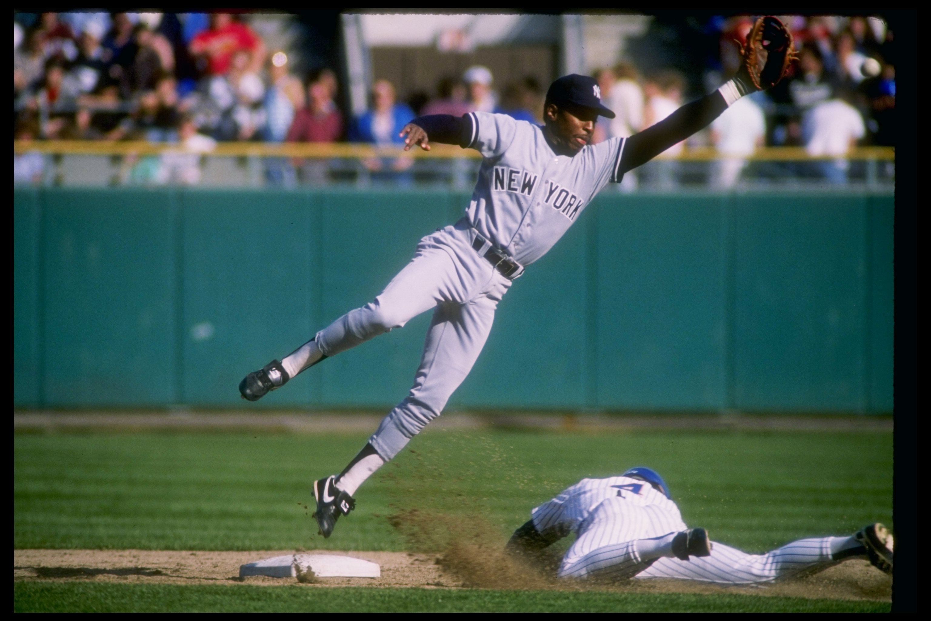 Infielder Willie Randolph of the New York Yankees (left) in action during a game.