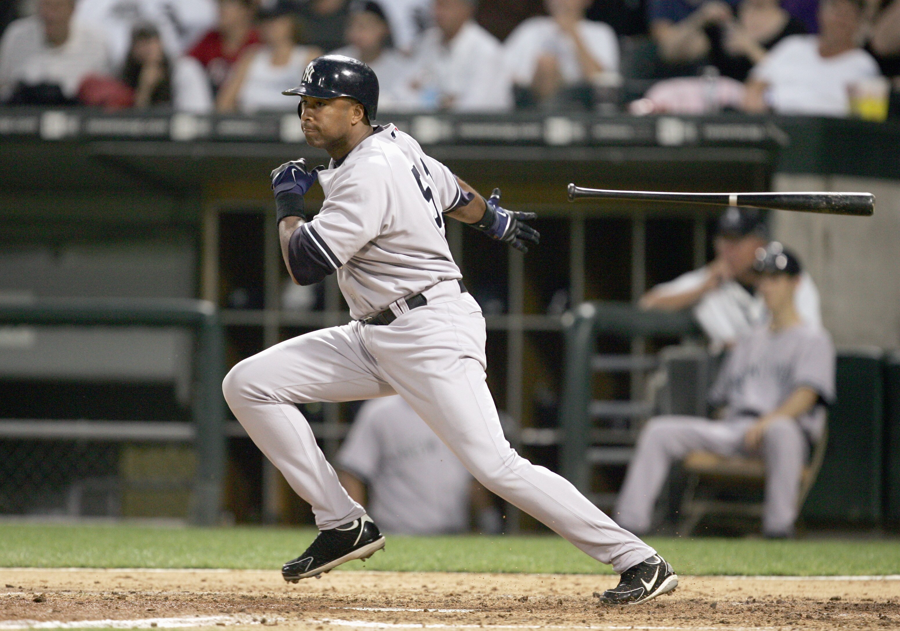 CHICAGO - AUGUST 9:  Bernie Williams #51 of the New York Yankees tosses the bat during the game against the Chicago White Sox on August 9, 2006 at U.S. Cellular Field in Chicago, Illinois. (Photo by Jonathan Daniel/Getty Images)