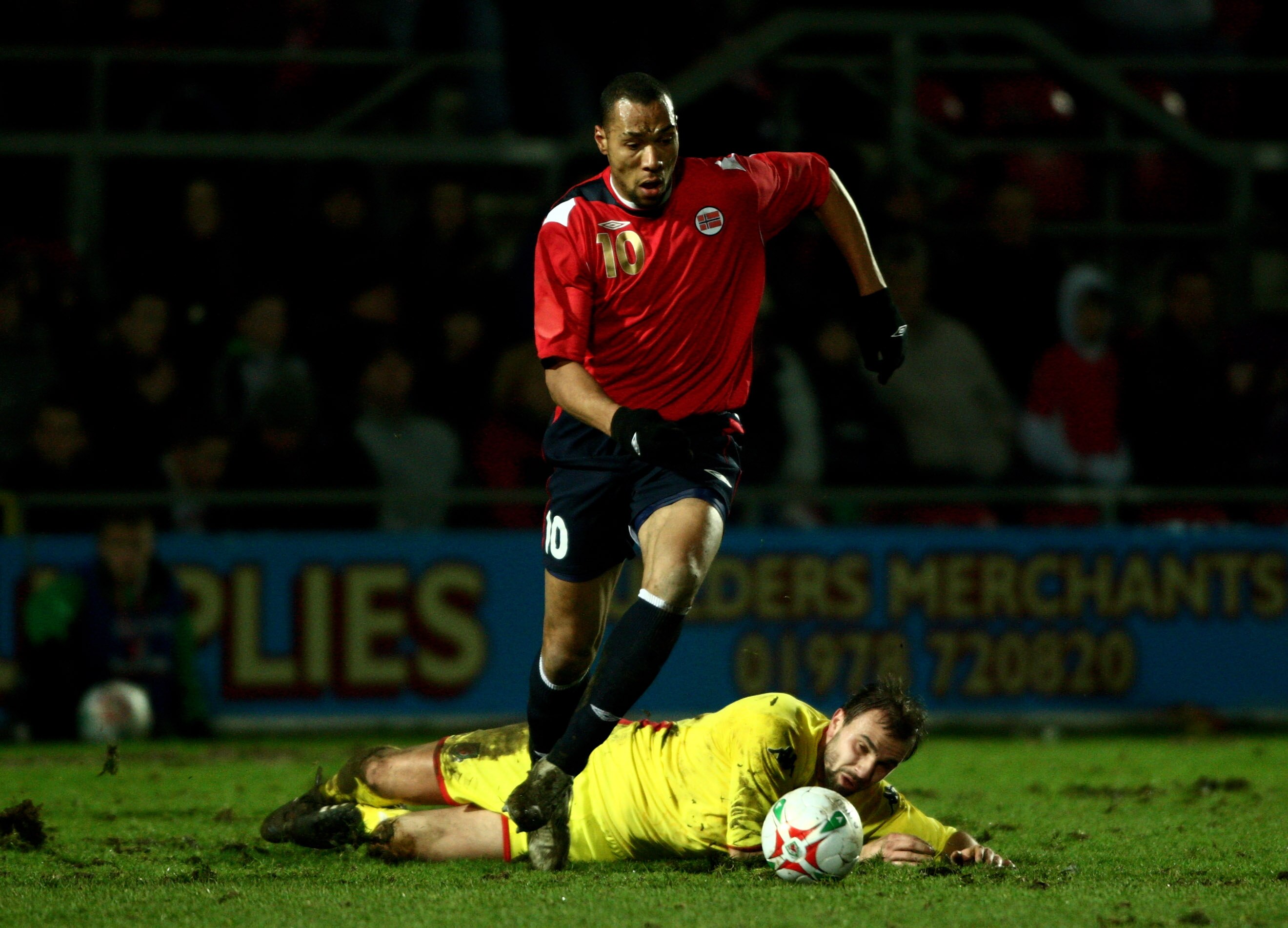 WREXHAM, UNITED KINGDOM - FEBRUARY 06: Norway striker John Carew leaves Wales player Carl Fletcher grounded during the International Friendly Match between Wales and Norway at The Racecourse Ground on February 6, 2008 in Wrexham, Wales.  (Photo by Stu For