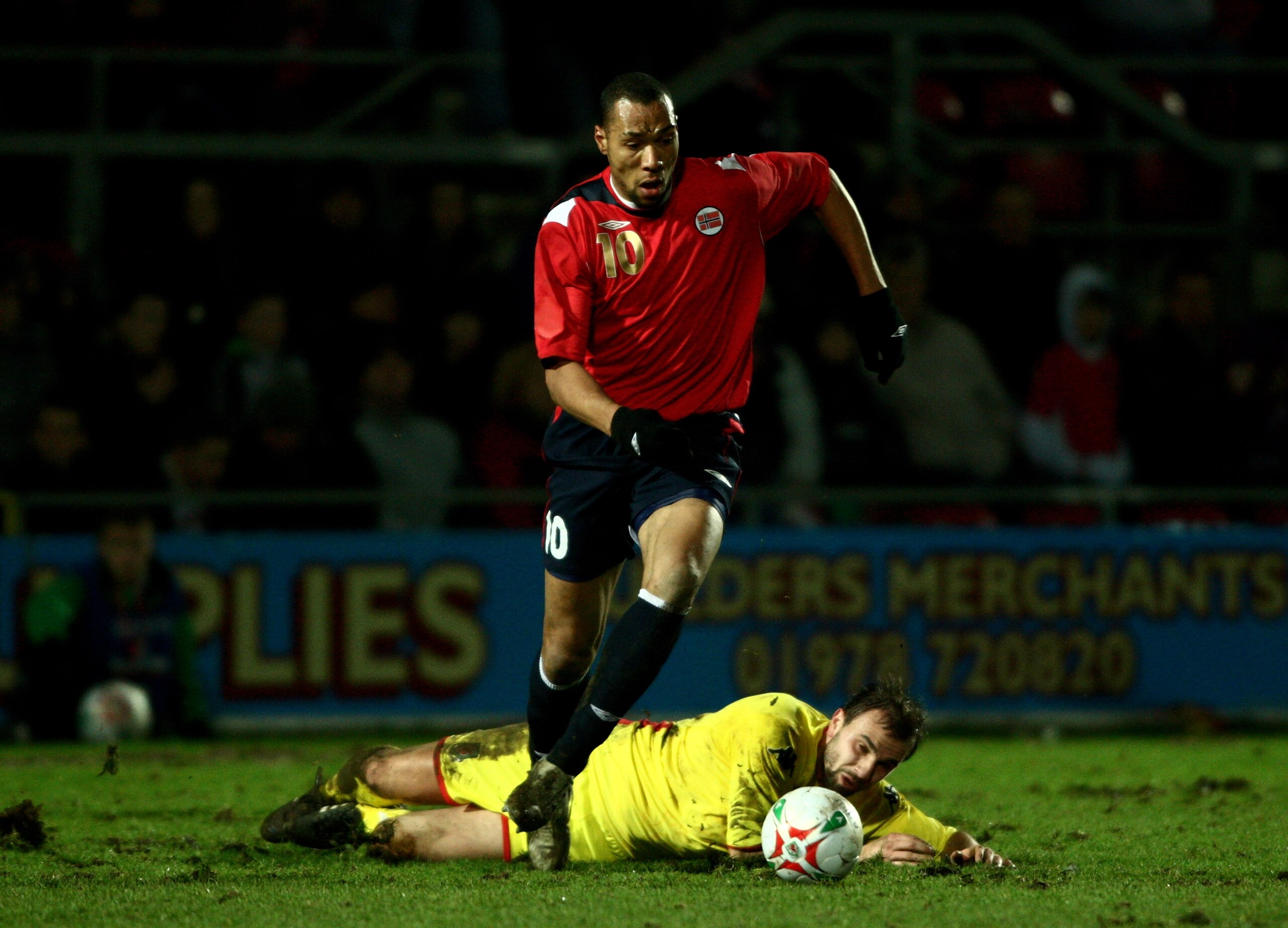 WREXHAM, UNITED KINGDOM - FEBRUARY 06: Norway striker John Carew leaves Wales player Carl Fletcher grounded during the International Friendly Match between Wales and Norway at The Racecourse Ground on February 6, 2008 in Wrexham, Wales.  (Photo by Stu For