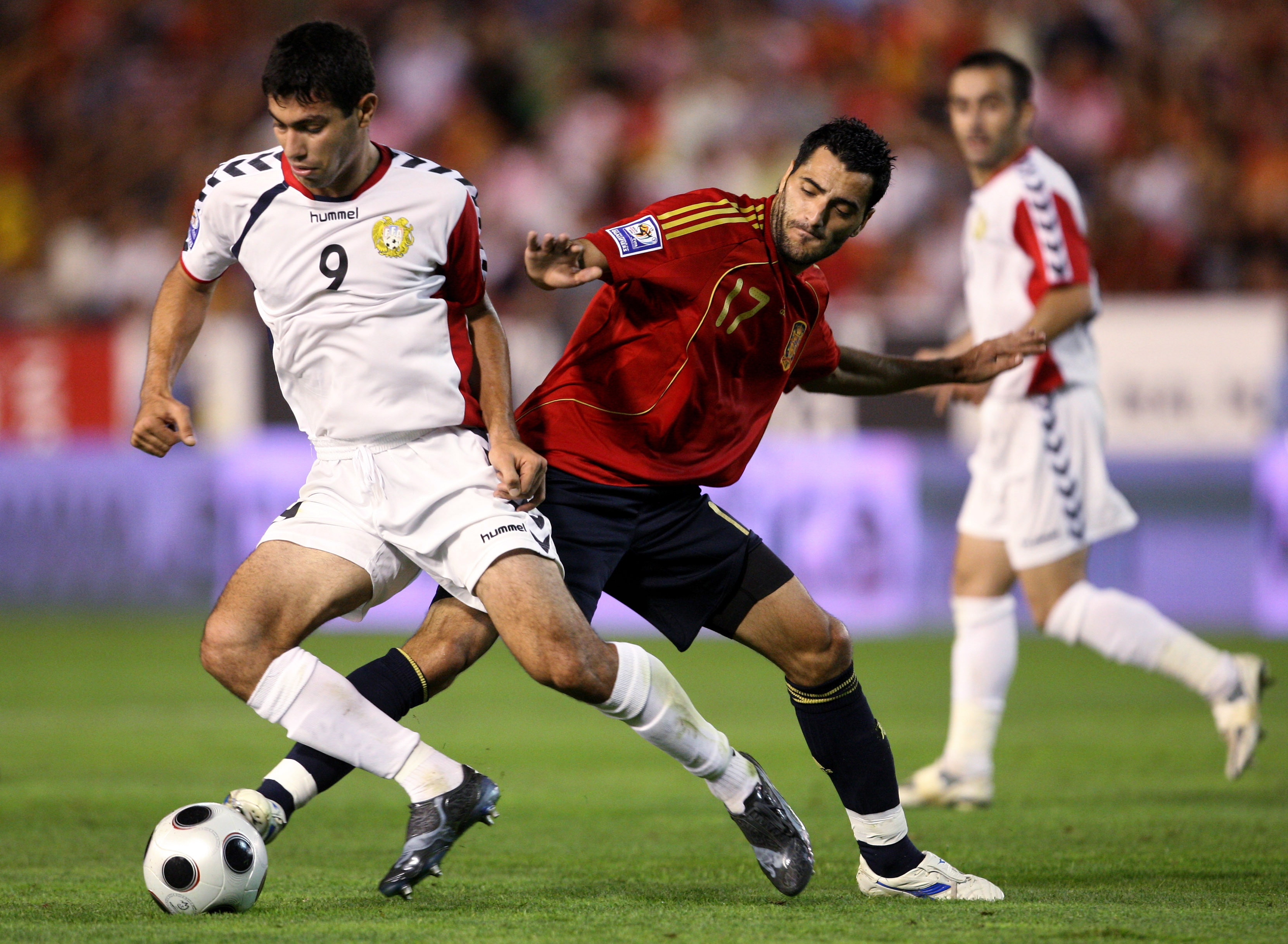 ALBACETE, SPAIN - SEPTEMBER 10:  Daniel Guiza (R) of Spain duels for the ball with Ararat Arakelyan of Armenia during the FIFA2010 World Cup Qualifier match between Spain and Armenia at the Carlos Belmonte Stadium on September 10, 2008 in Albacete, Spain.