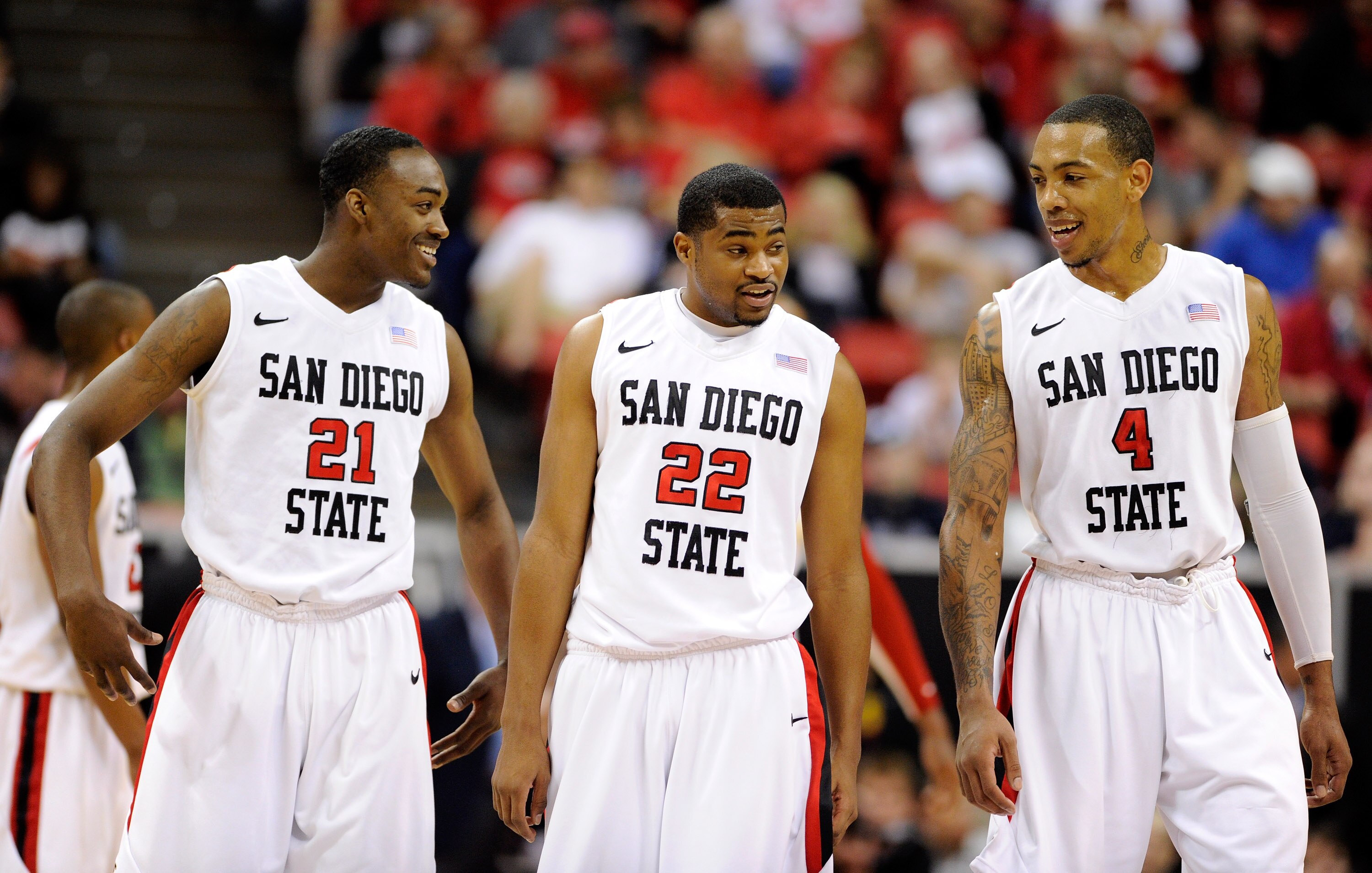 LAS VEGAS, NV - MARCH 10:  Jamaal Franklin #21, Chase Tapley #22 and Malcolm Thomas #4 of the San Diego State Aztecs share a laugh during a quarterfinal game of the Conoco Mountain West Conference Basketball tournament against the Utah Utes at the Thomas