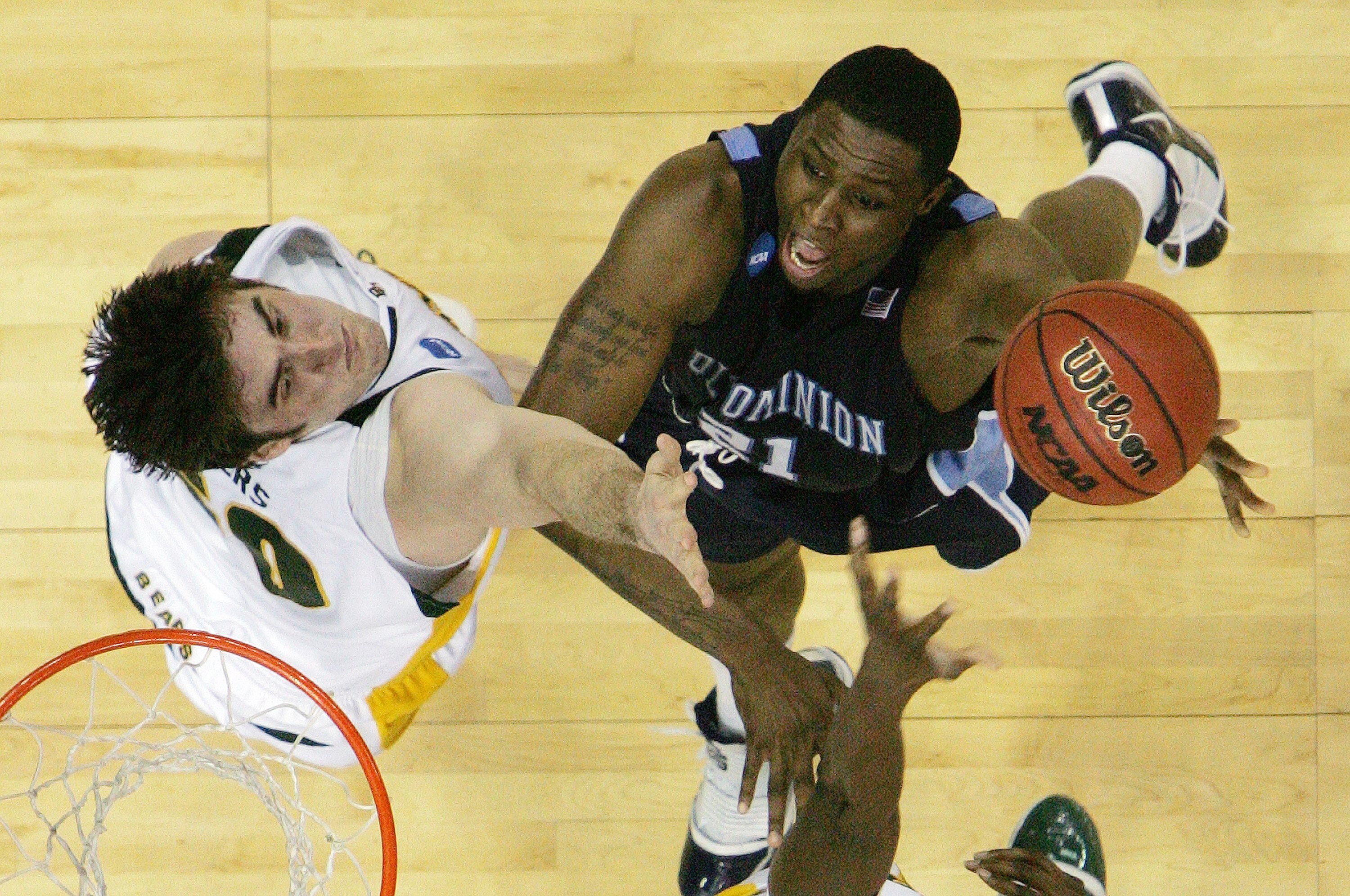 NEW ORLEANS - MARCH 20: Frank Hassell #21 of the Old Dominion Monarchs scores against Josh Lomers #50 of the Baylor Bears during the second round of the 2010 NCAA men's basketball tournament at the New Orleans Arena on March 20, 2010 in New Orleans, Loui NEW ORLEANS - MARCH 20: Frank Hassell #21 of the Old Dominion Monarchs scores against Josh Lomers #50 of the Baylor Bears during the second round of the 2010 NCAA men's basketball tournament at the New Orleans Arena on March 20, 2010 in New Orleans, Loui