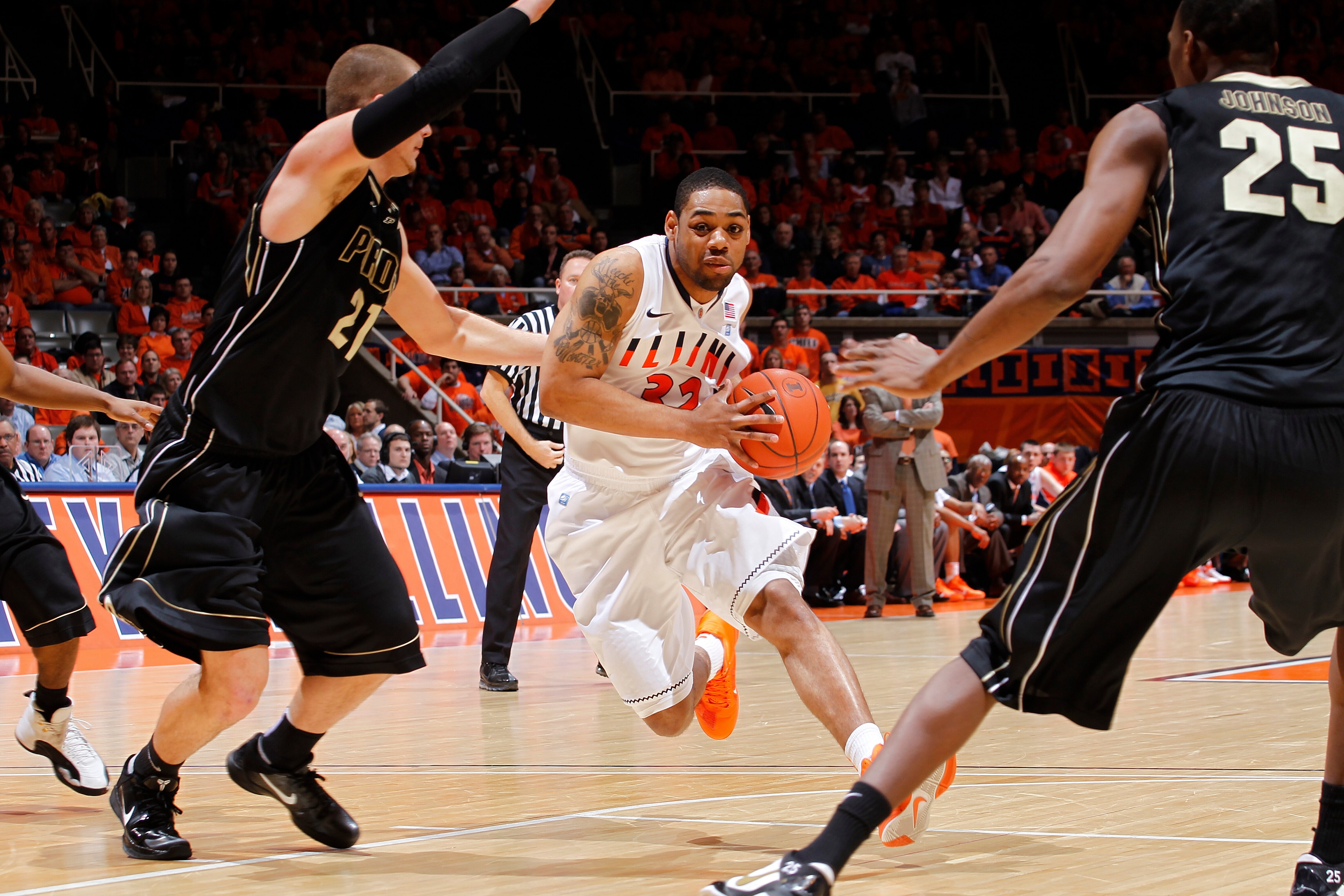 CHAMPAIGN, IL - FEBRUARY 13: Demetri McCamey #32 of the Illinois Fighting Illini goes to the basket against the Purdue Boilermakers at Assembly Hall on February 13, 2011 in Champaign, Illinois. Purdue defeated Illinois 81-70. (Photo by Joe Robbins/Getty I CHAMPAIGN, IL - FEBRUARY 13: Demetri McCamey #32 of the Illinois Fighting Illini goes to the basket against the Purdue Boilermakers at Assembly Hall on February 13, 2011 in Champaign, Illinois. Purdue defeated Illinois 81-70. (Photo by Joe Robbins/Getty I