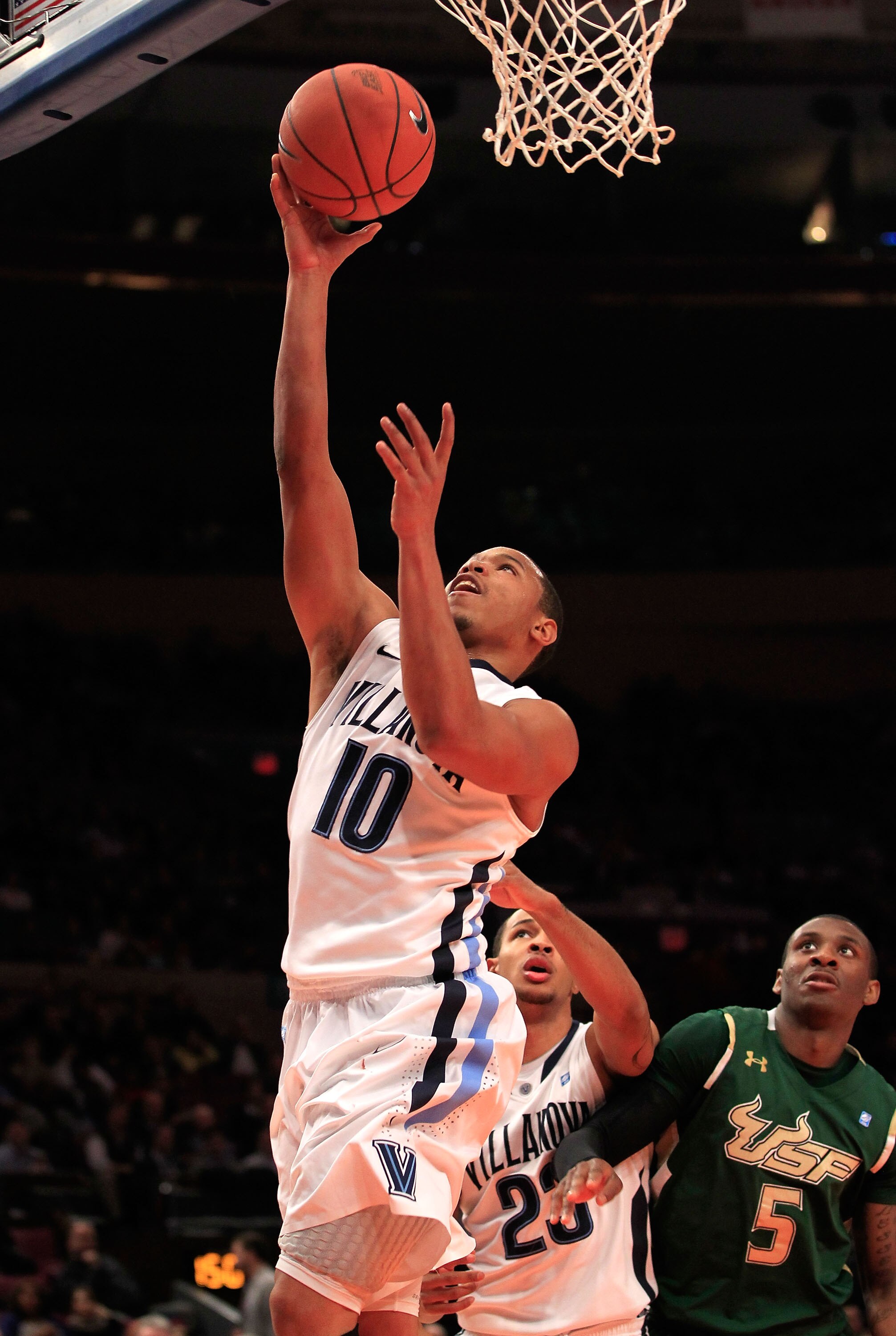 NEW YORK, NY - MARCH 08: Corey Fisher #10 of the Villanova Wildcats drives to the hoop against the South Florida Bulls during the first round of the 2011 Big East Men's Basketball Tournament presented by American Eagle Outfitters at Madison Square Garden 