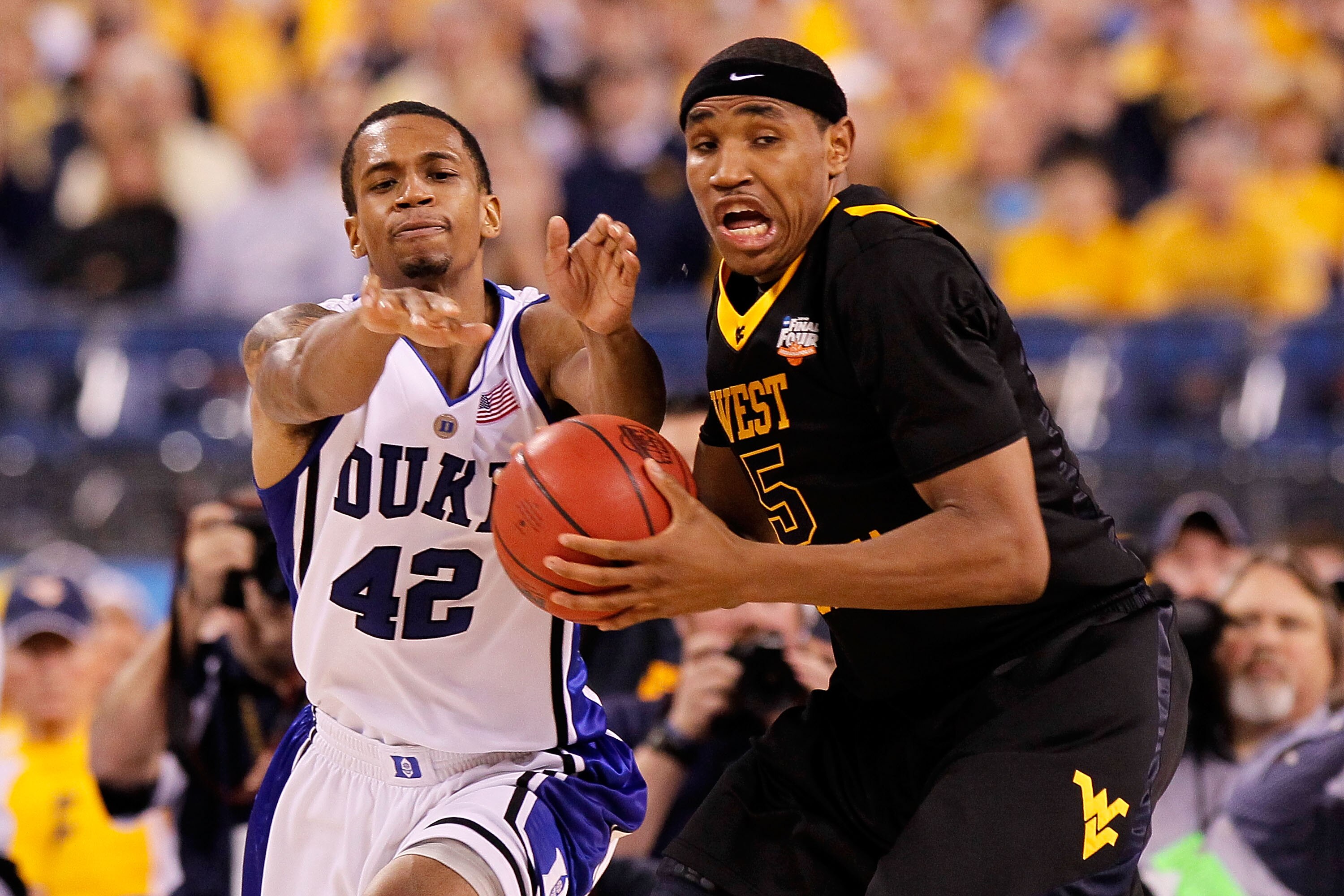 INDIANAPOLIS - APRIL 03: Lance Thomas #42 of the Duke Blue Devils goes for a steal on Kevin Jones #5 of the West Virginia Mountaineers in the second half during the National Semifinal game of the 2010 NCAA Division I Men's Basketball Championship at Luca INDIANAPOLIS - APRIL 03: Lance Thomas #42 of the Duke Blue Devils goes for a steal on Kevin Jones #5 of the West Virginia Mountaineers in the second half during the National Semifinal game of the 2010 NCAA Division I Men's Basketball Championship at Luca