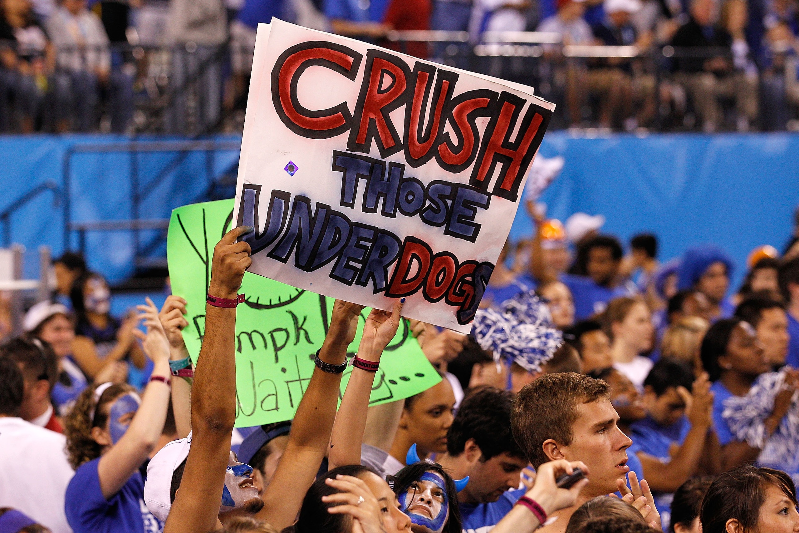 INDIANAPOLIS - APRIL 05:  Fans of the Duke Blue Devils hold up a sign which reads 'Crush those UnderDogs' in reference to the Butler Bulldogs during the 2010 NCAA Division I Men's Basketball National Championship game at Lucas Oil Stadium on April 5, 2010