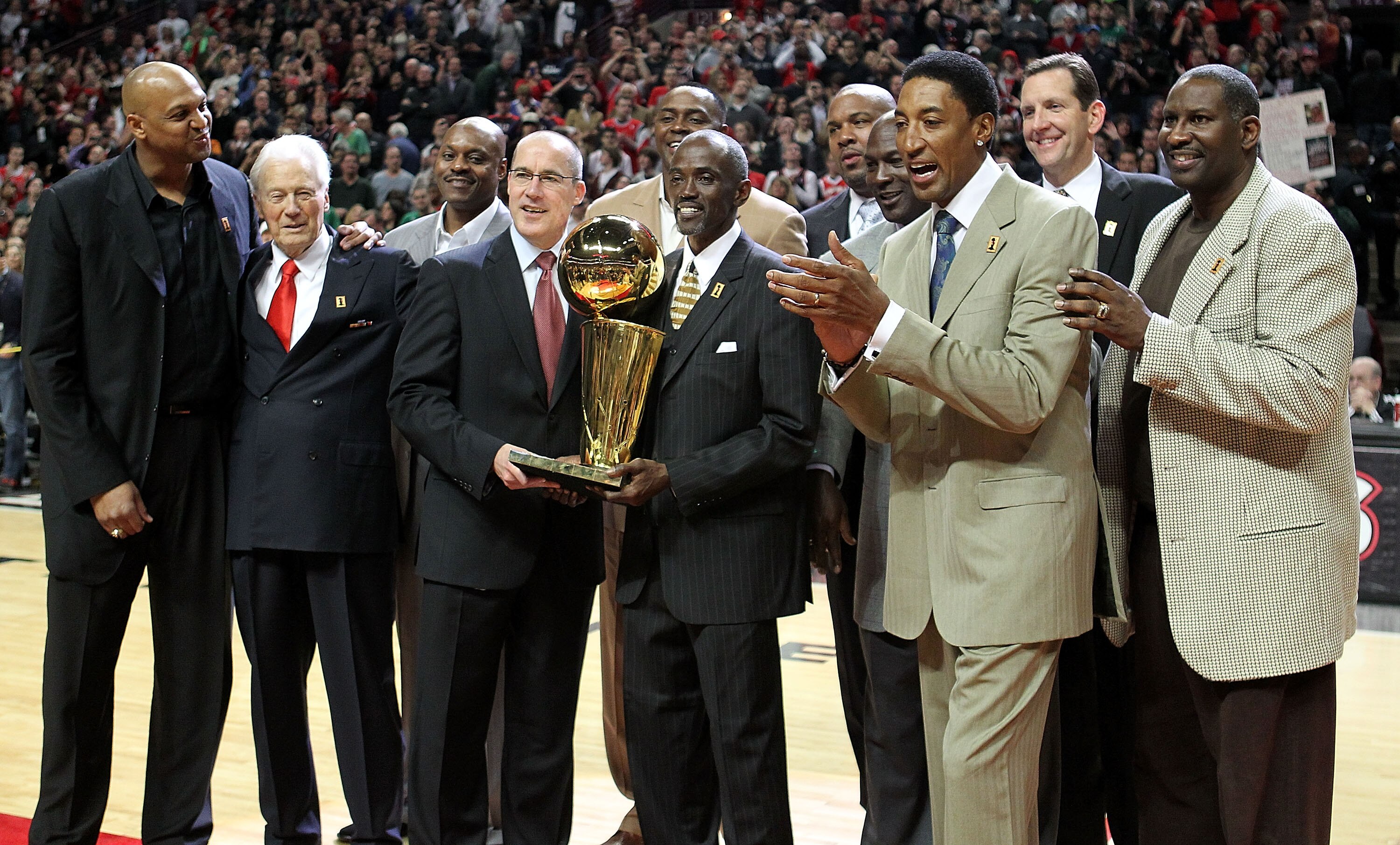 CHICAGO, IL - MARCH 12: (L-R) Former players  Scott Williams, assistant coach Johnny Bach, Dennis Hopson, John Paxson, Horace Grant, Craig Hodges, Stacey King, Michael Jordan, Scottie Pippen, Will Purdue and Cliff Levingston of the Chicago Bulls pose with
