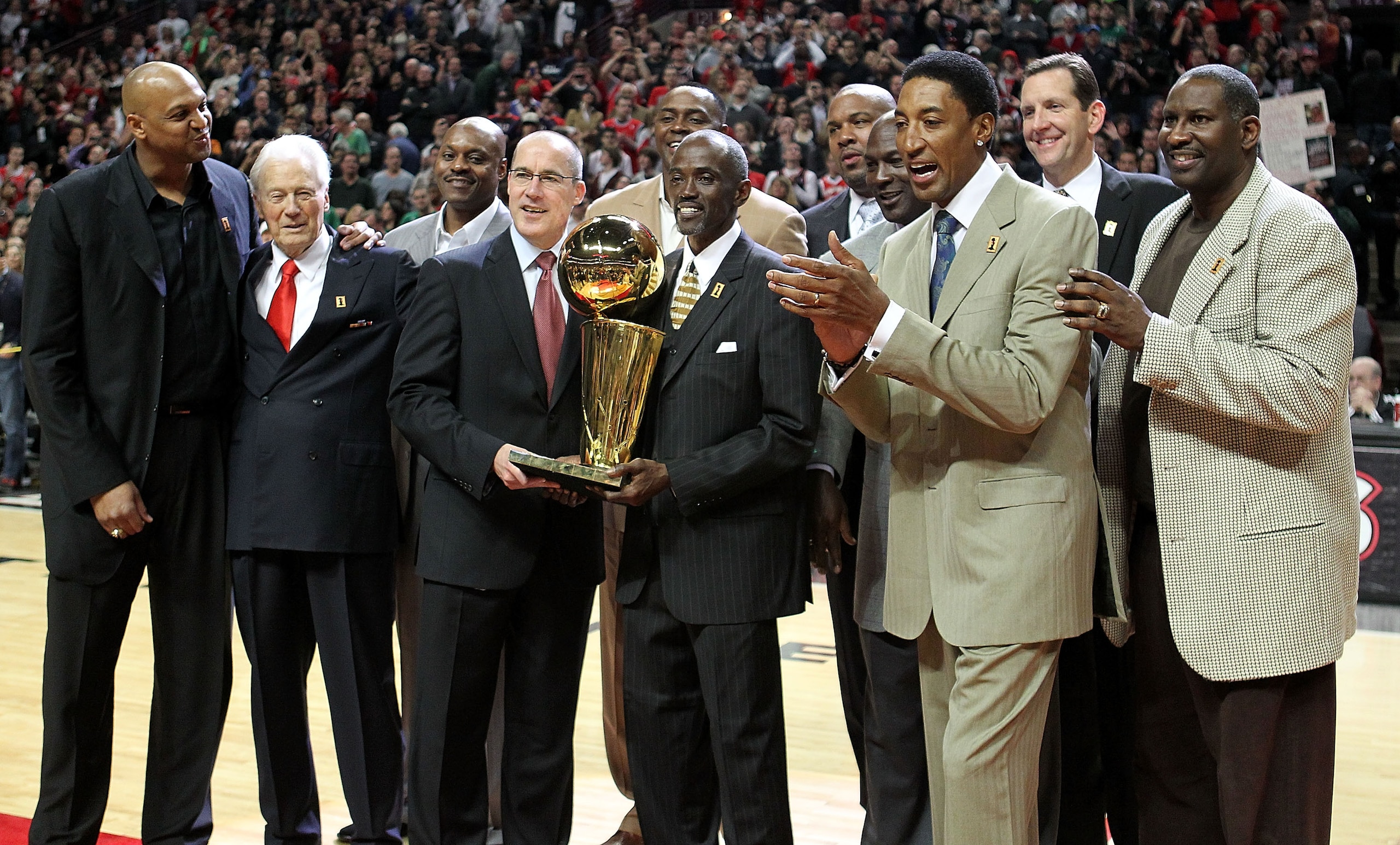 CHICAGO, IL - MARCH 12: (L-R) Former players  Scott Williams, assistant coach Johnny Bach, Dennis Hopson, John Paxson, Horace Grant, Craig Hodges, Stacey King, Michael Jordan, Scottie Pippen, Will Purdue and Cliff Levingston of the Chicago Bulls pose with