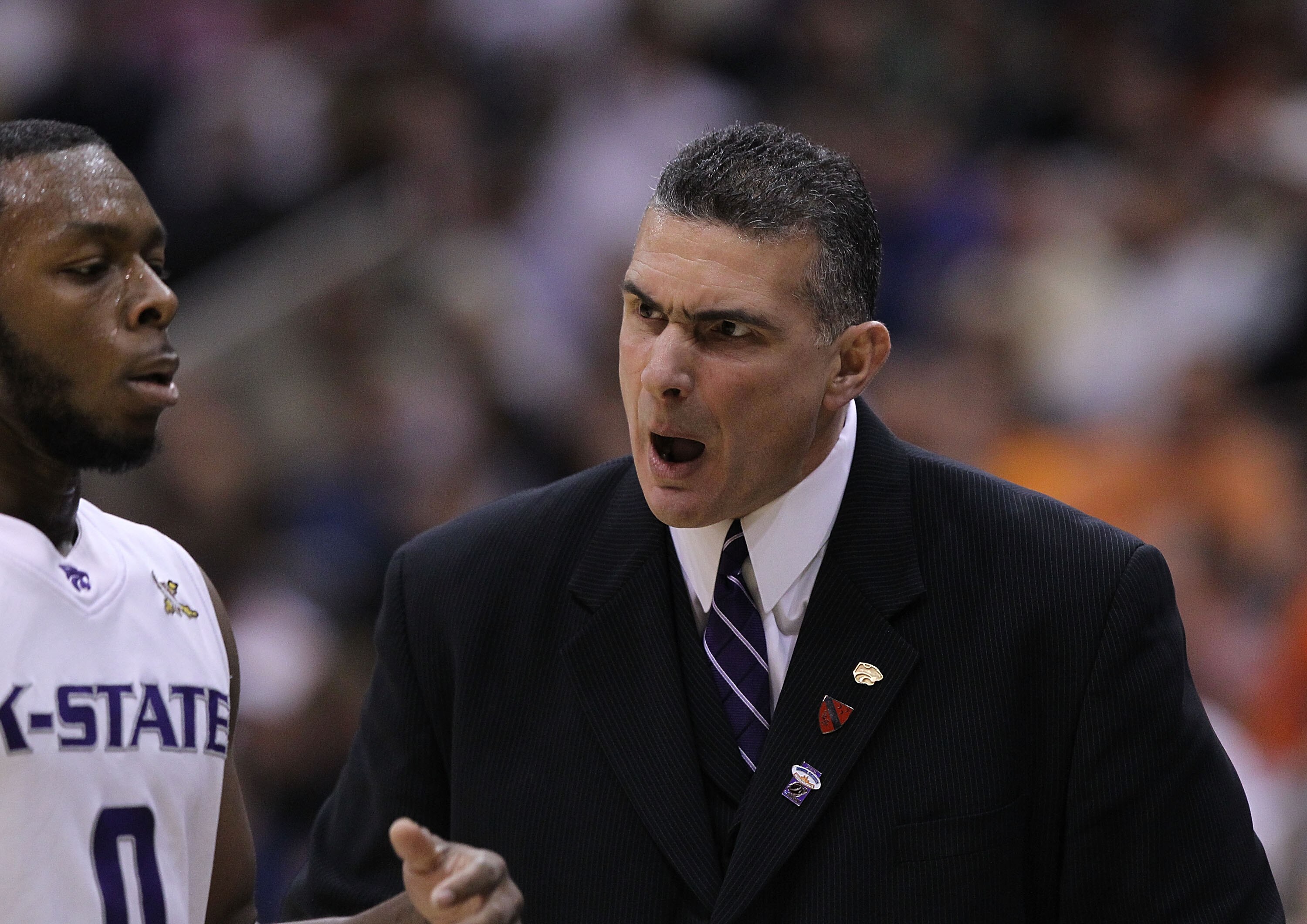 SALT LAKE CITY - MARCH 25:  Head coach Frank Martin of the Kansas State Wildcats yells at Jacob Pullen #0 against the Xavier Musketeers during the third round of the 2010 NCAA menï¿½s basketball tournament at the Energy Solutions Arena on March 25, 2010 in