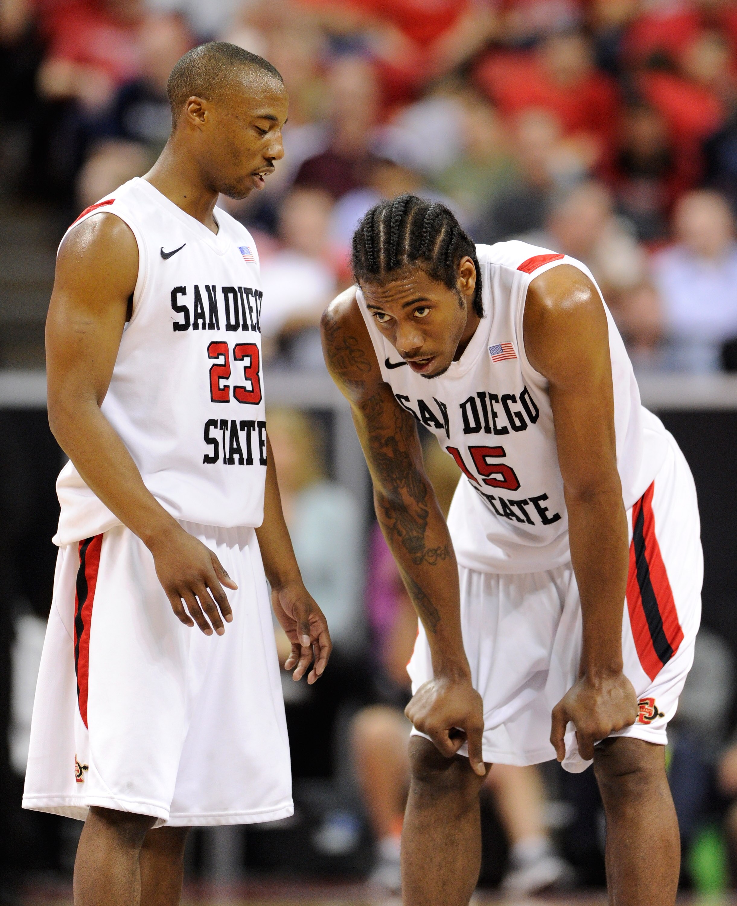LAS VEGAS, NV - MARCH 11:  D.J. Gay #23 of the San Diego State Aztecs talks to teammate Kawhi Leonard #15 during a semifinal game of the Conoco Mountain West Conference Basketball tournament at the Thomas & Mack Center March 11, 2011 in Las Vegas, Nevada.