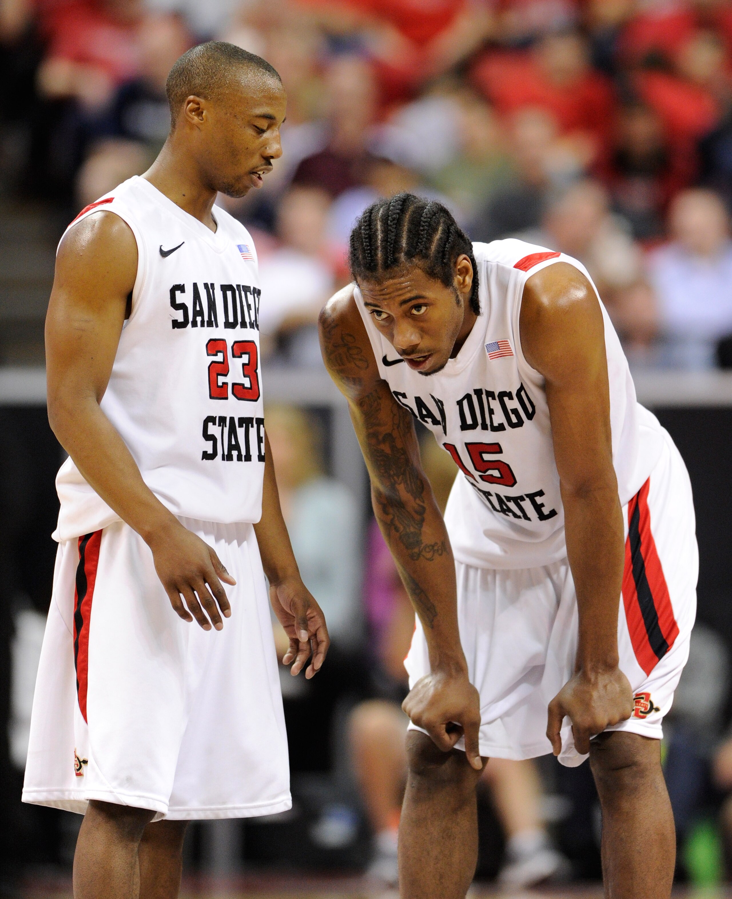 LAS VEGAS, NV - MARCH 11:  D.J. Gay #23 of the San Diego State Aztecs talks to teammate Kawhi Leonard #15 during a semifinal game of the Conoco Mountain West Conference Basketball tournament at the Thomas & Mack Center March 11, 2011 in Las Vegas, Nevada.